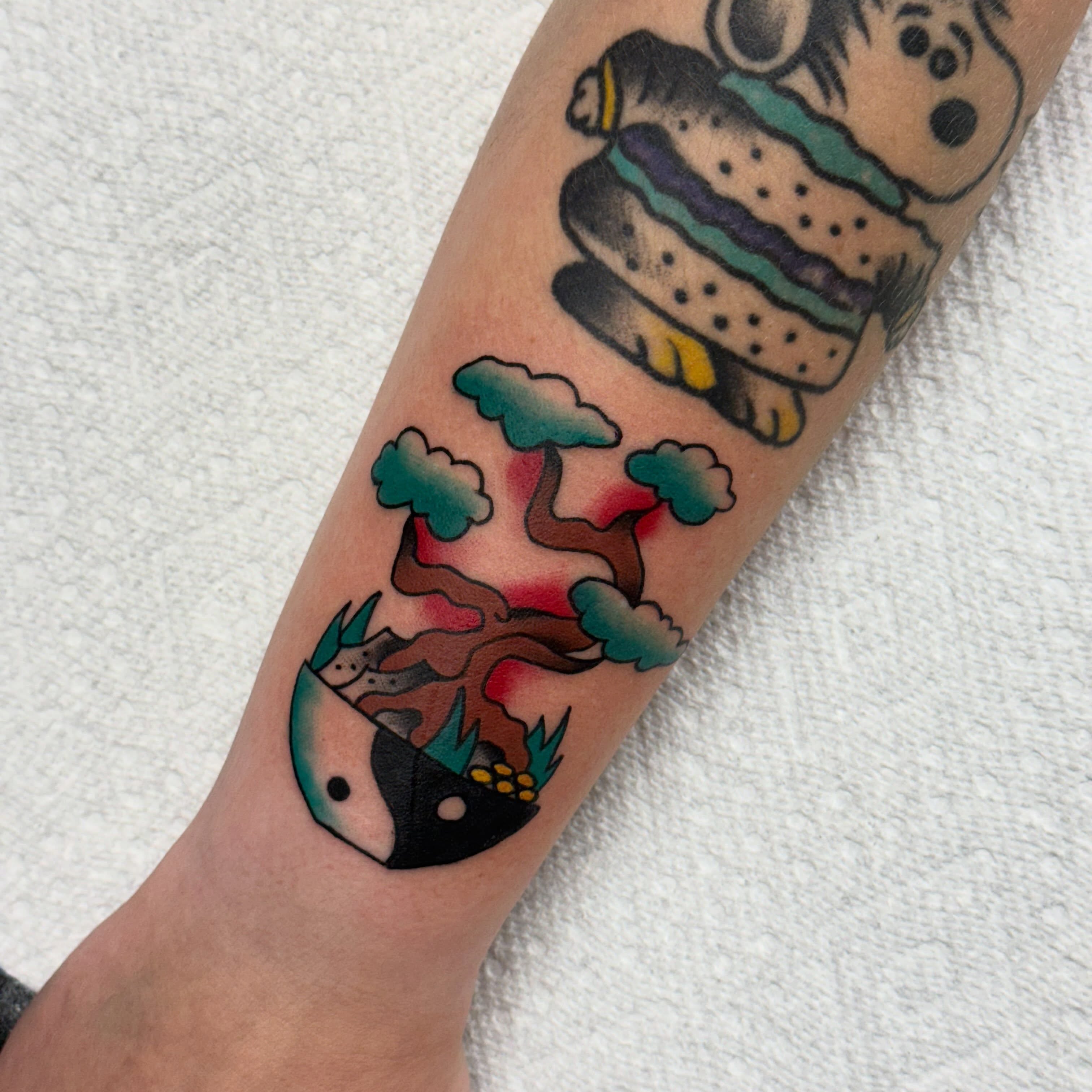 Fish and bonsai American traditional tattoo on the forearm by Ben