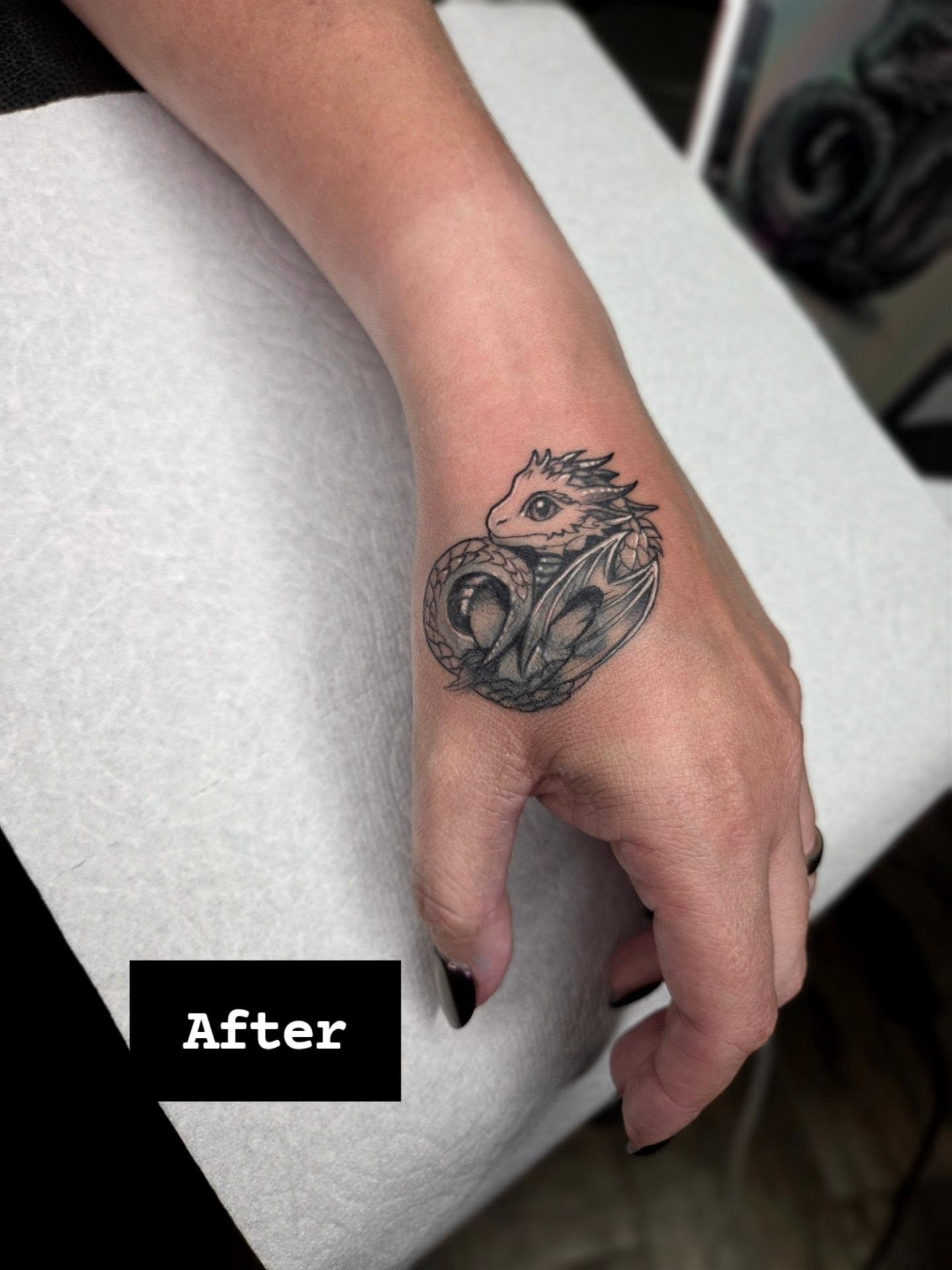 Dragon black and grey tattoo on the hand by Yvette Cebreros