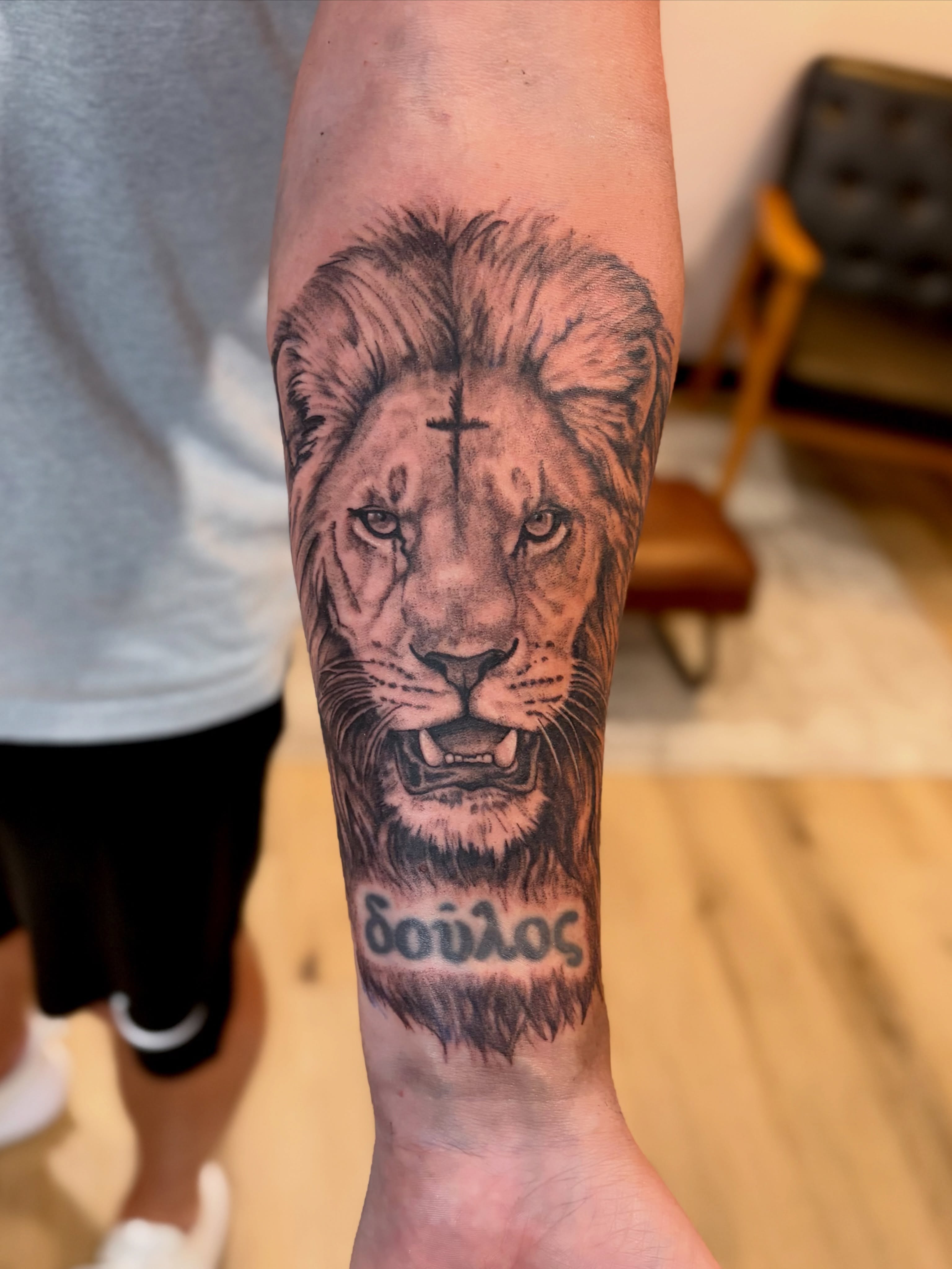 Lion realism tattoo on the forearm by Emily, Monticello, Iowa