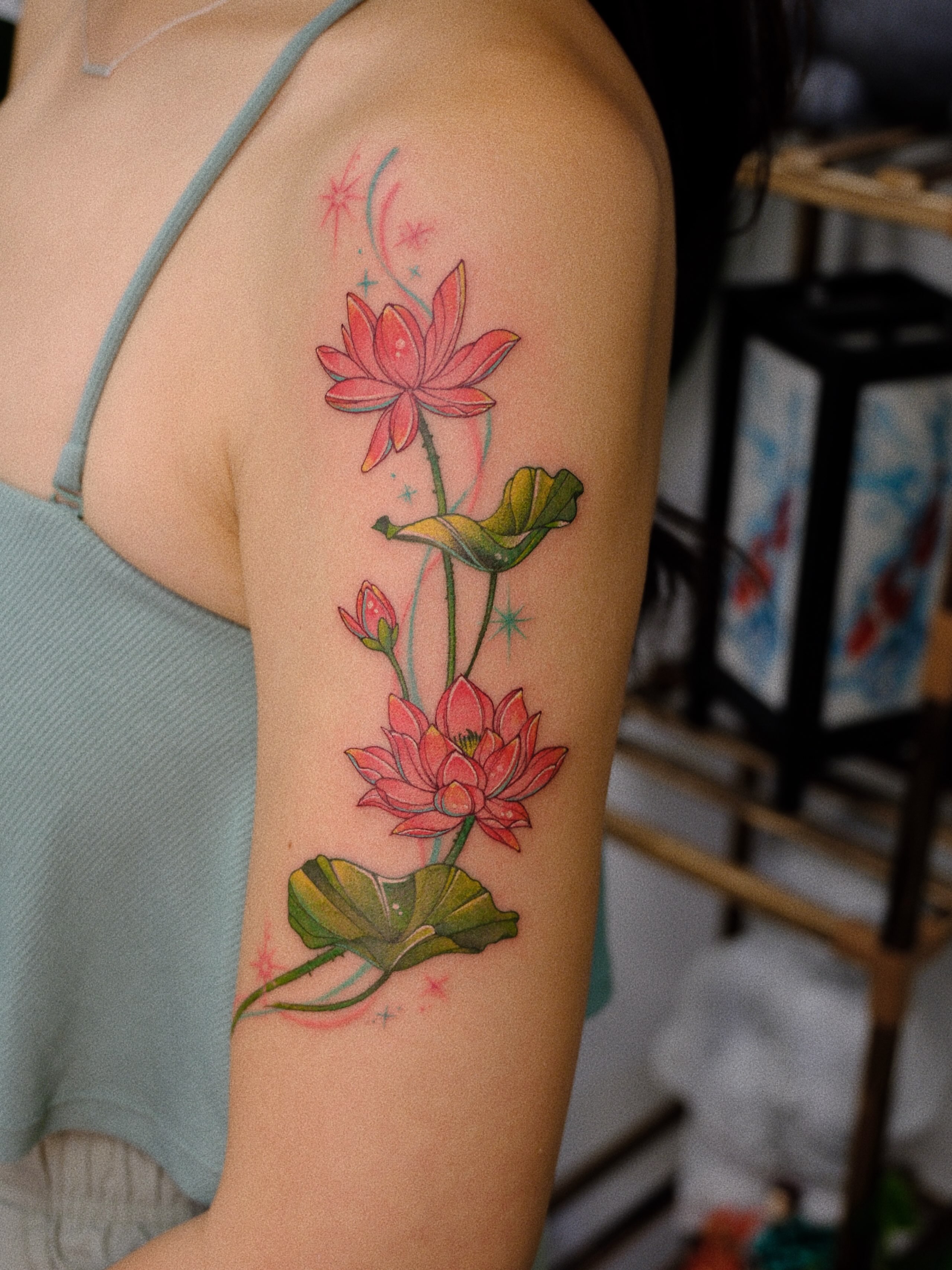 Lotus flowers watercolor tattoo on the forearm by rita_tattooist