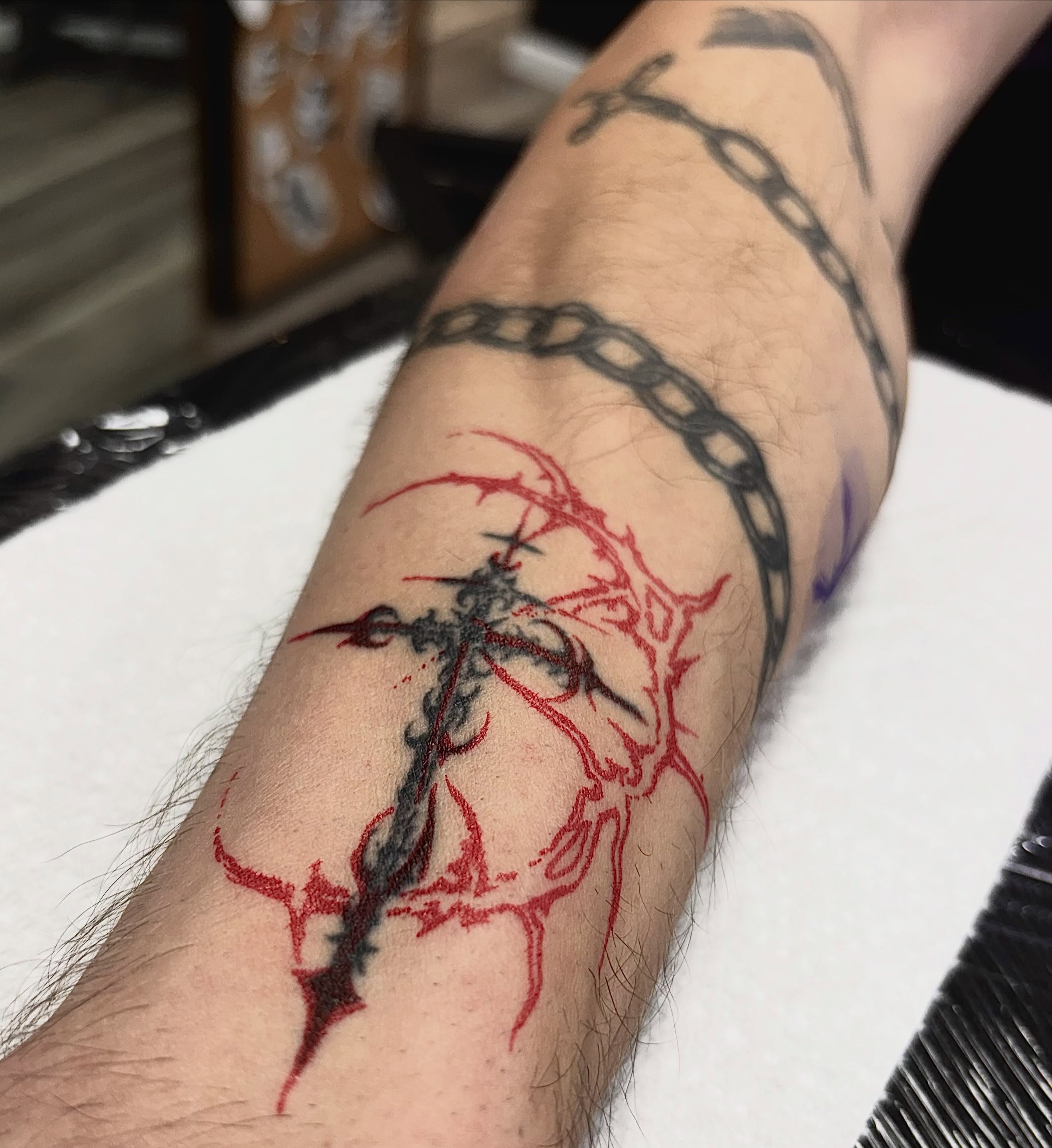 Cross with thorns neo-traditional tattoo on the forearm by Alle