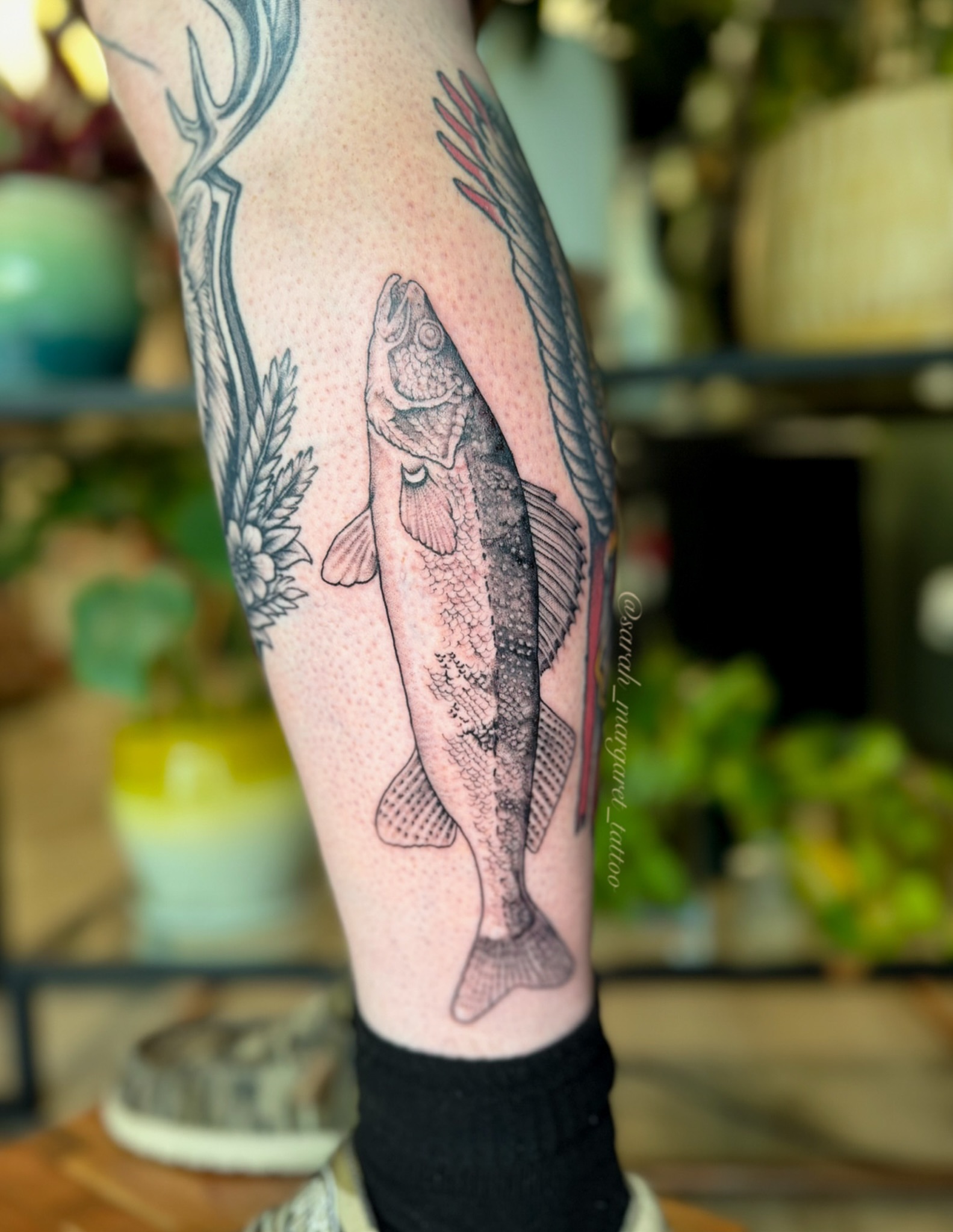 Trout dotwork tattoo on the calf by Sarah Margaret