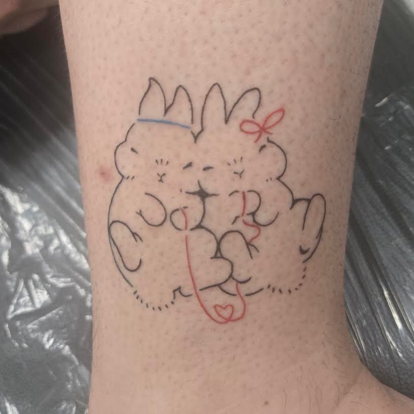 Two cats fine line tattoo on the forearm by Isaac Mccavitt