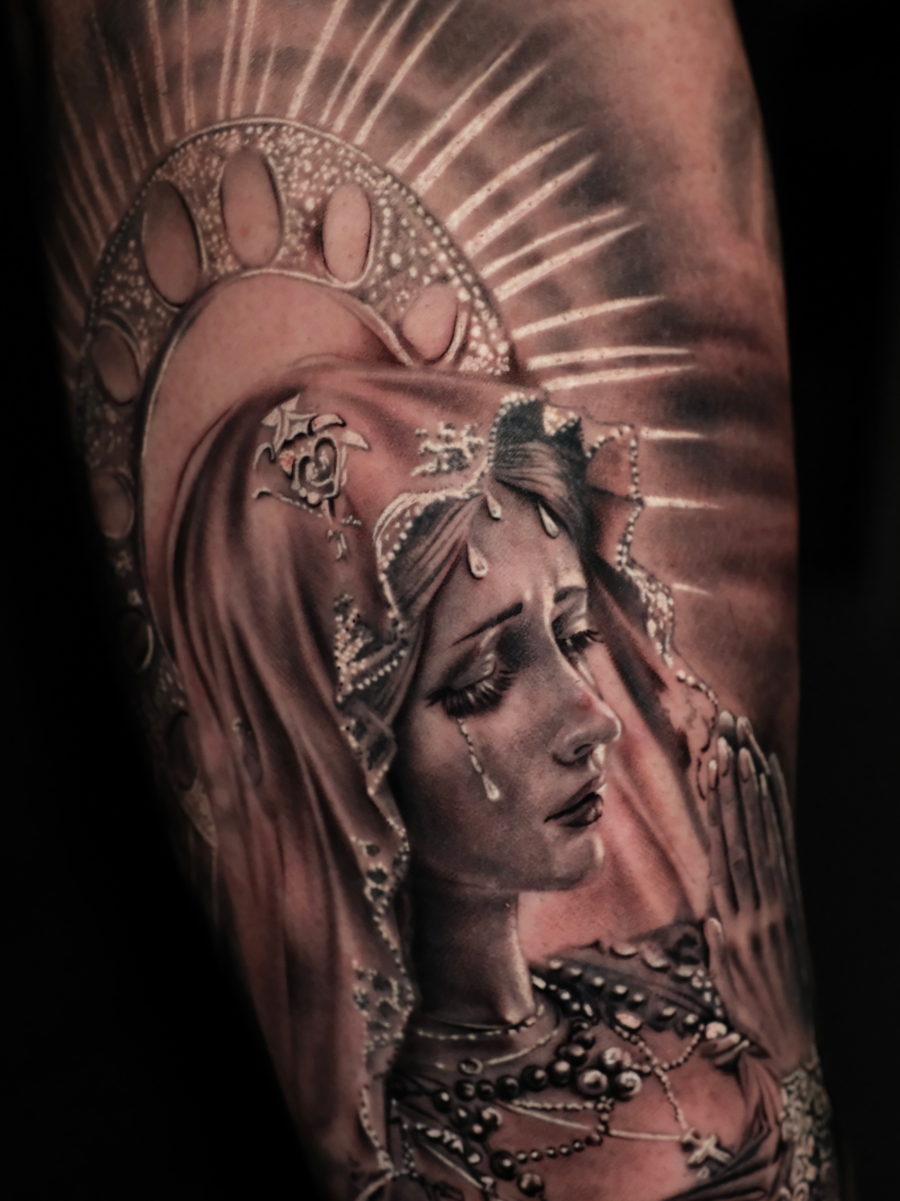 Religious figure realism tattoo on the forearm by Josy Castro