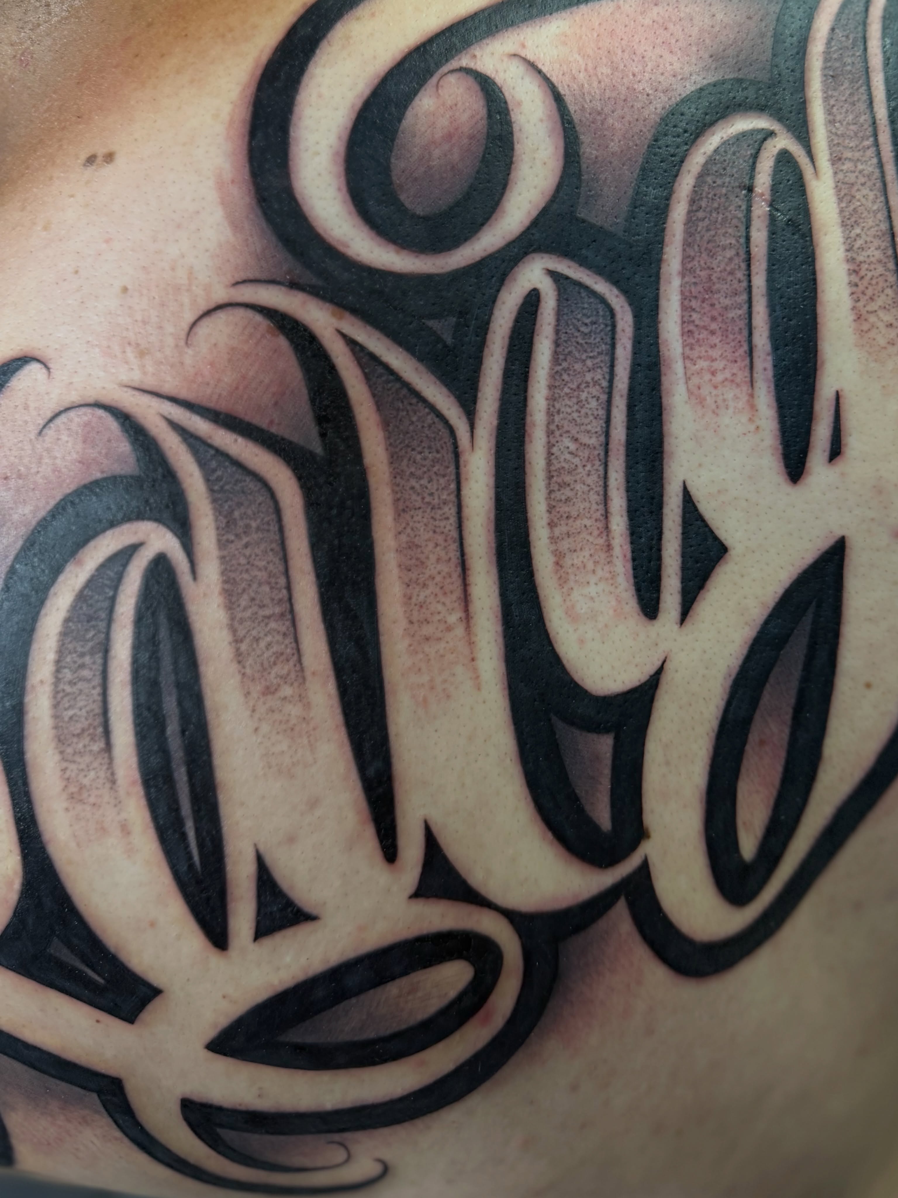Script lettering lettering script tattoo on the shoulder by Rocky G Inkz LLC