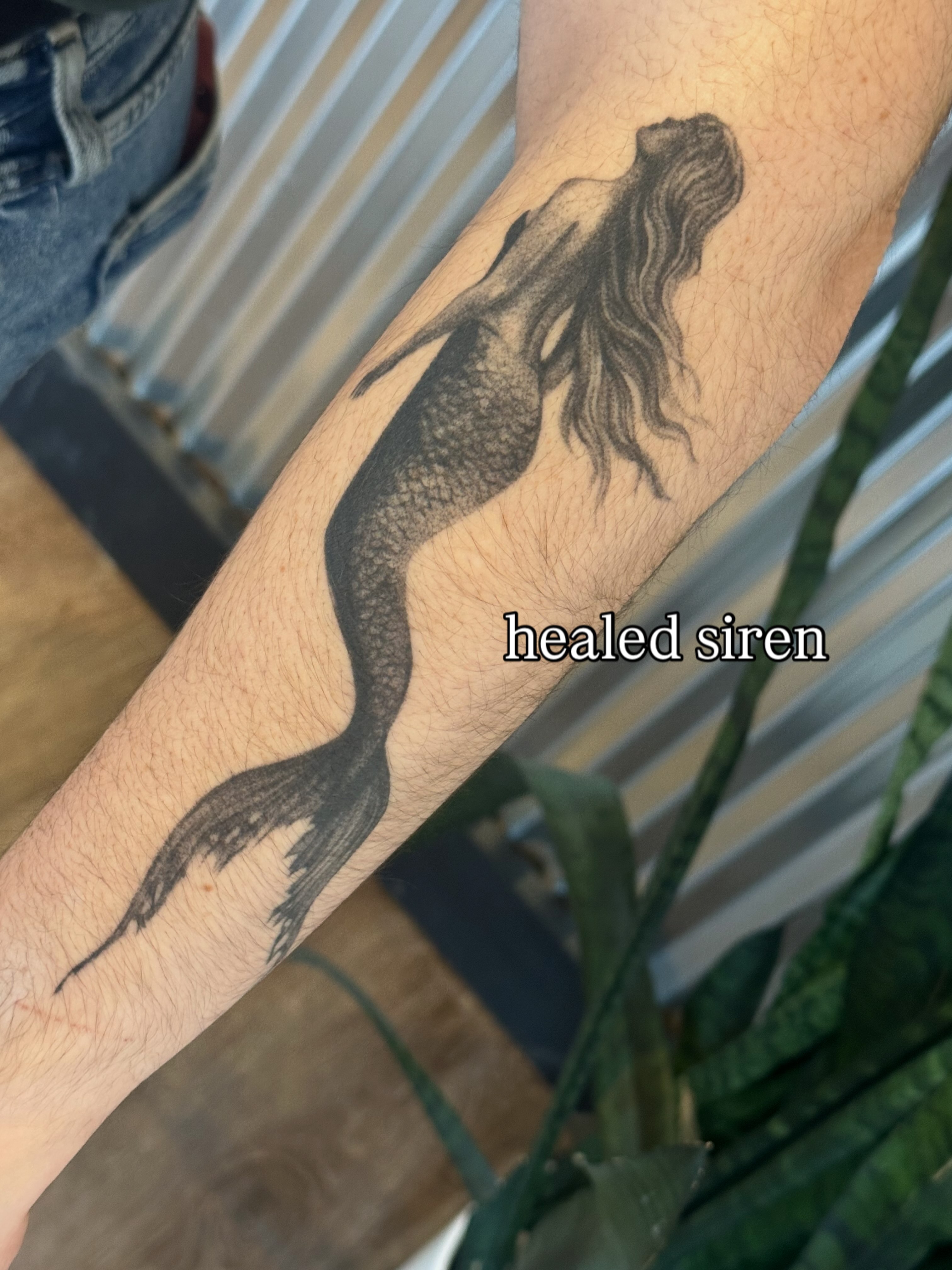 Mermaid black and grey tattoo on the forearm by sara scak, Lakewood, Ohio
