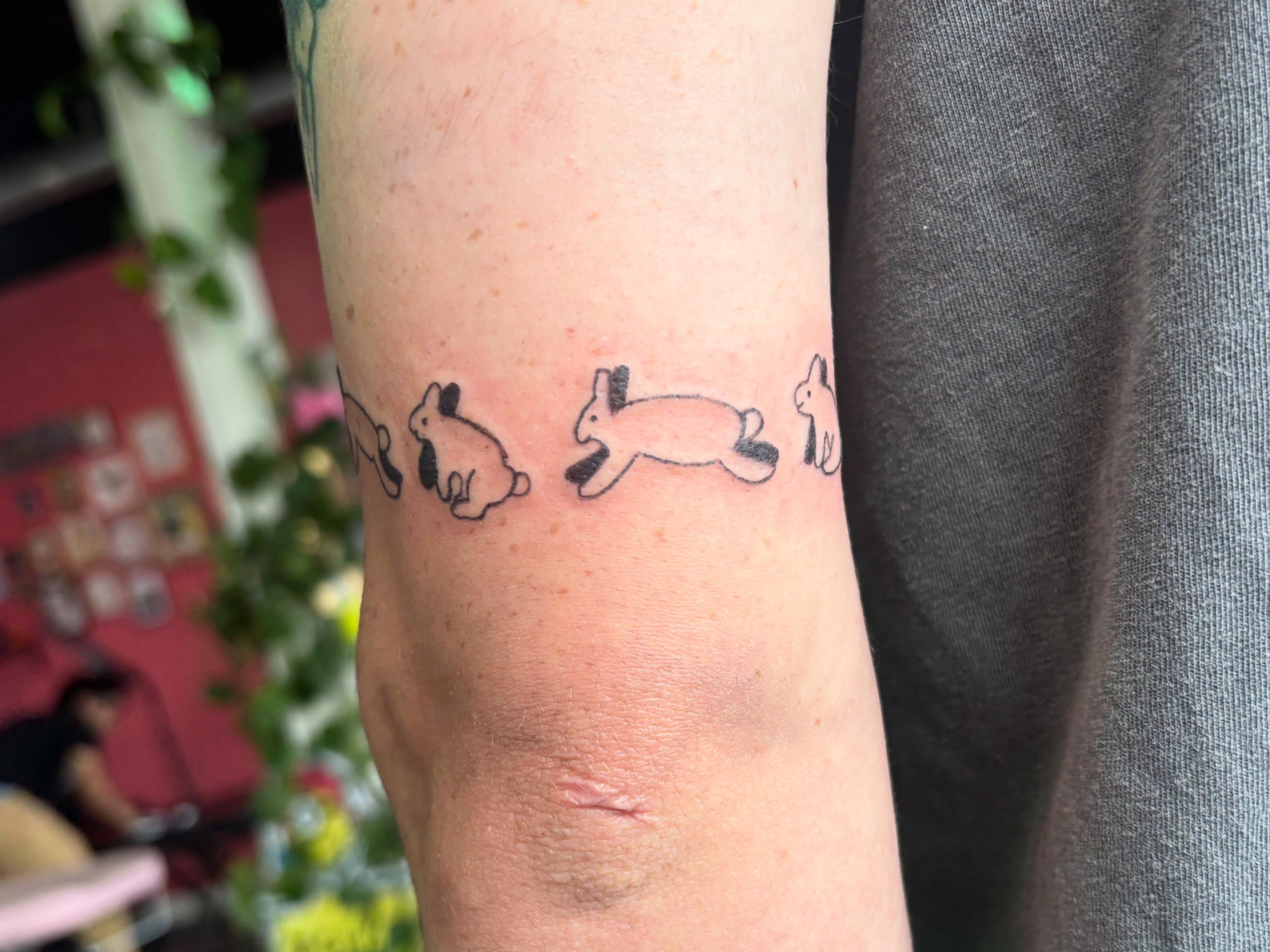 Rabbits minimalist tattoo on the forearm by Hiro Robinson