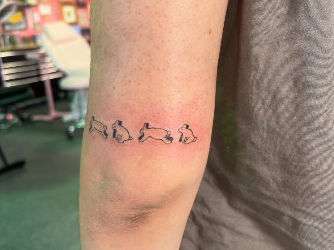 Rabbits dotwork tattoo on the forearm by Hiro Robinson