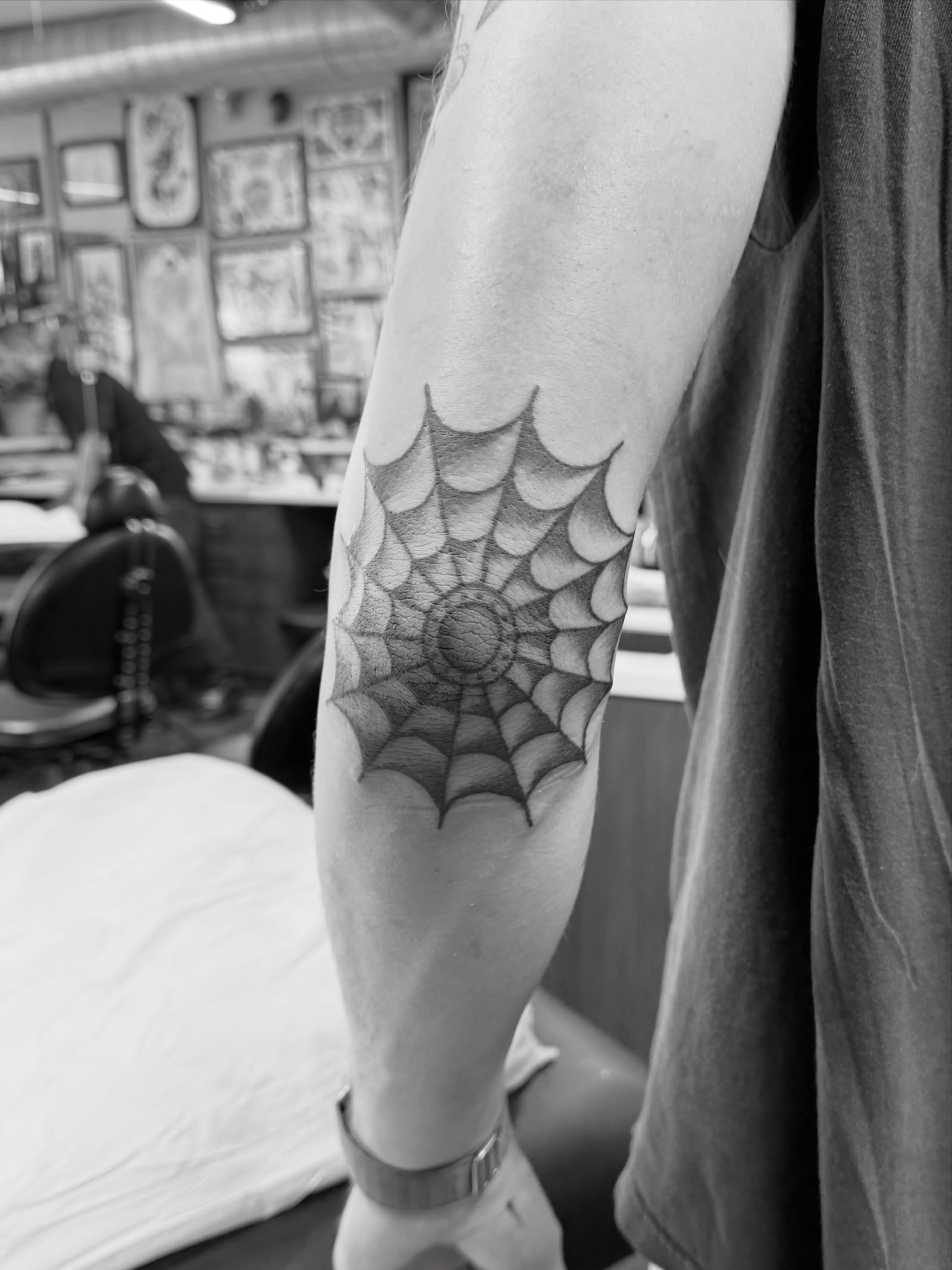 Spiderweb geometric tattoo on the forearm by Aaron ulfstam