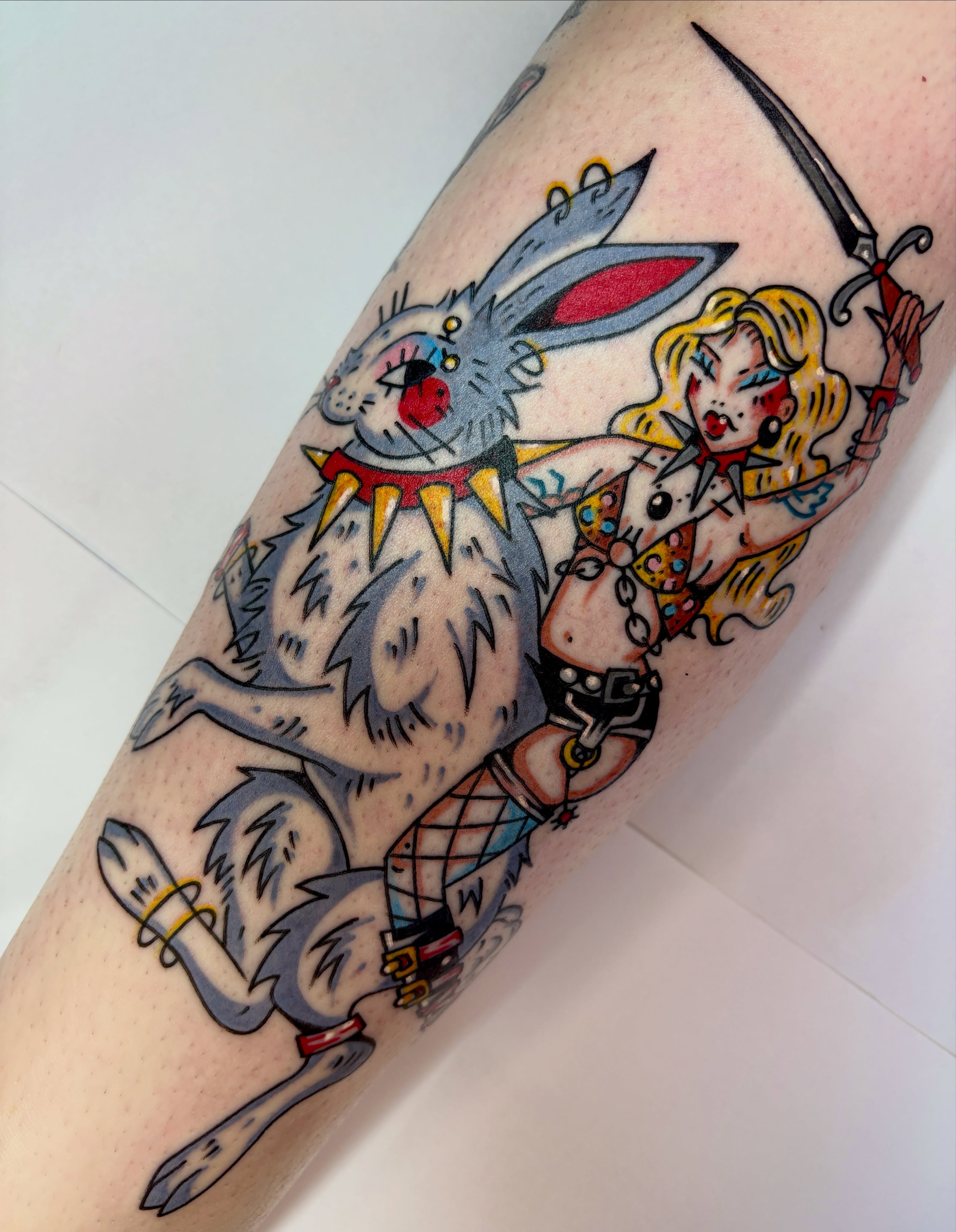 Alice and rabbit American traditional tattoo on the forearm by Bella