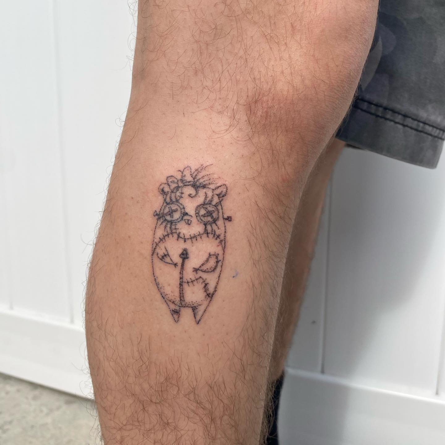 Stitched creature minimalist tattoo on the forearm by @feverfeverish