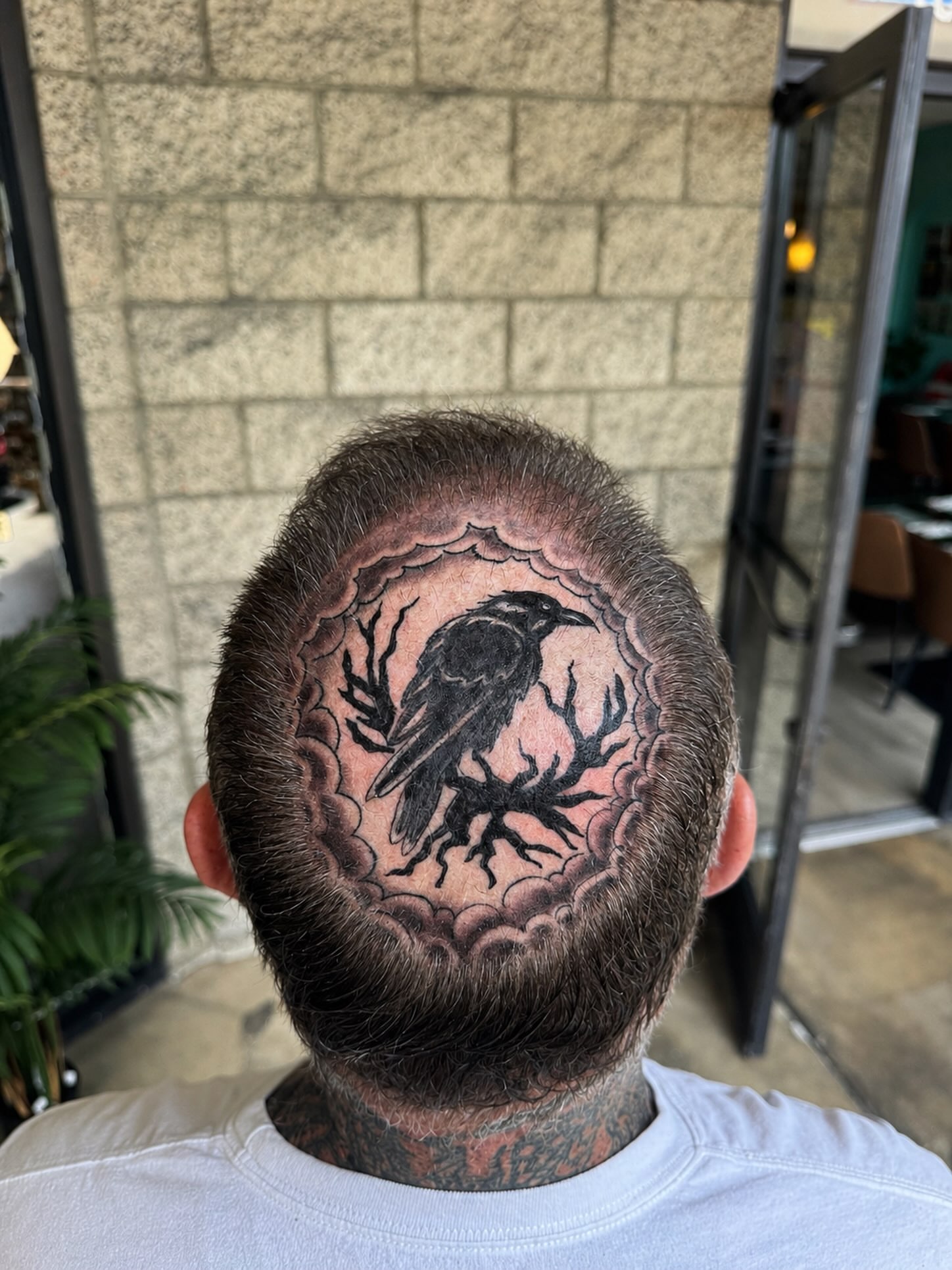 Crow black and grey tattoo on the head by LeLe