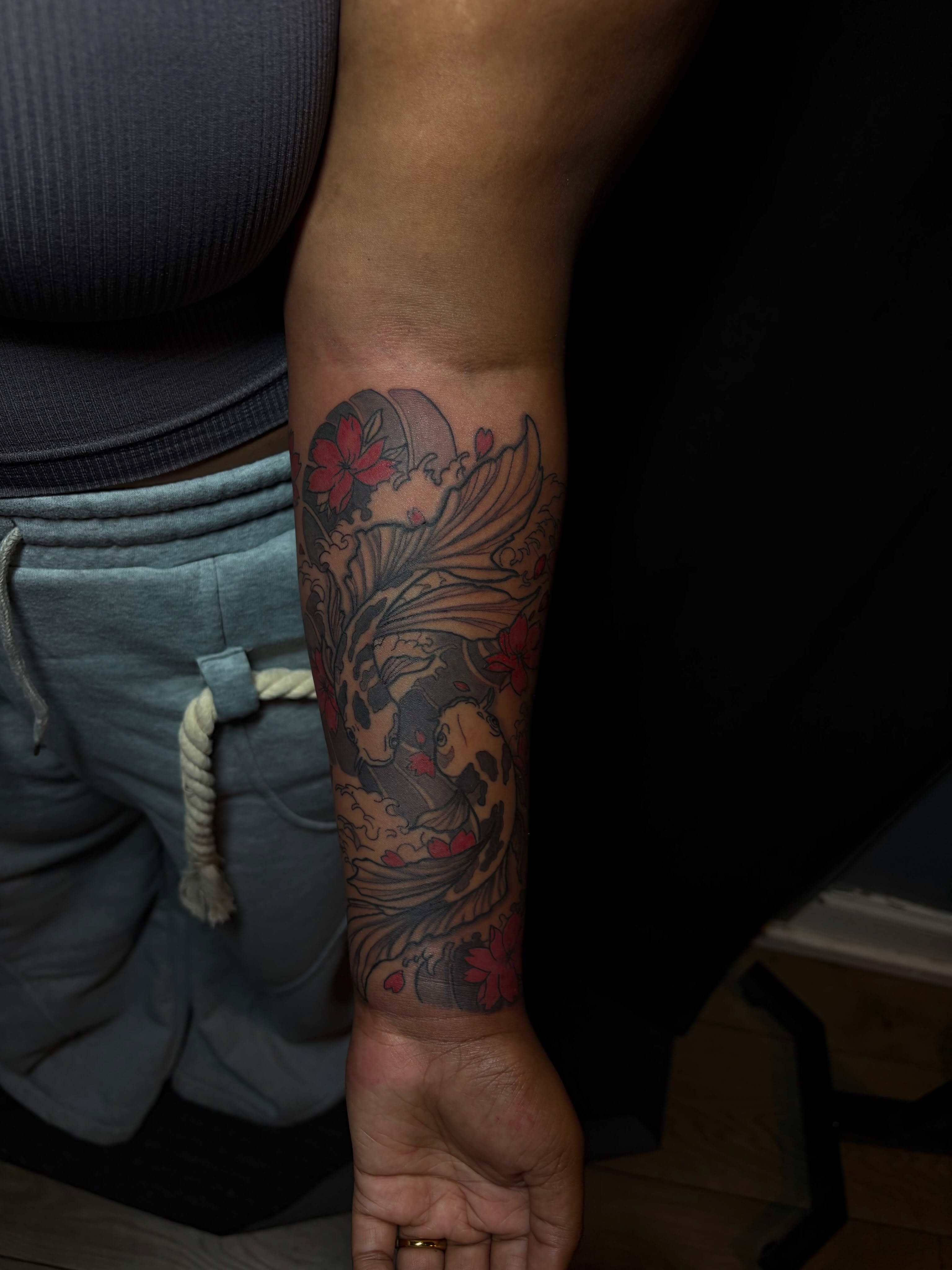 Koi fish and cherry blossoms japanese irezumi tattoo on the forearm by SpicyMvstardInkk