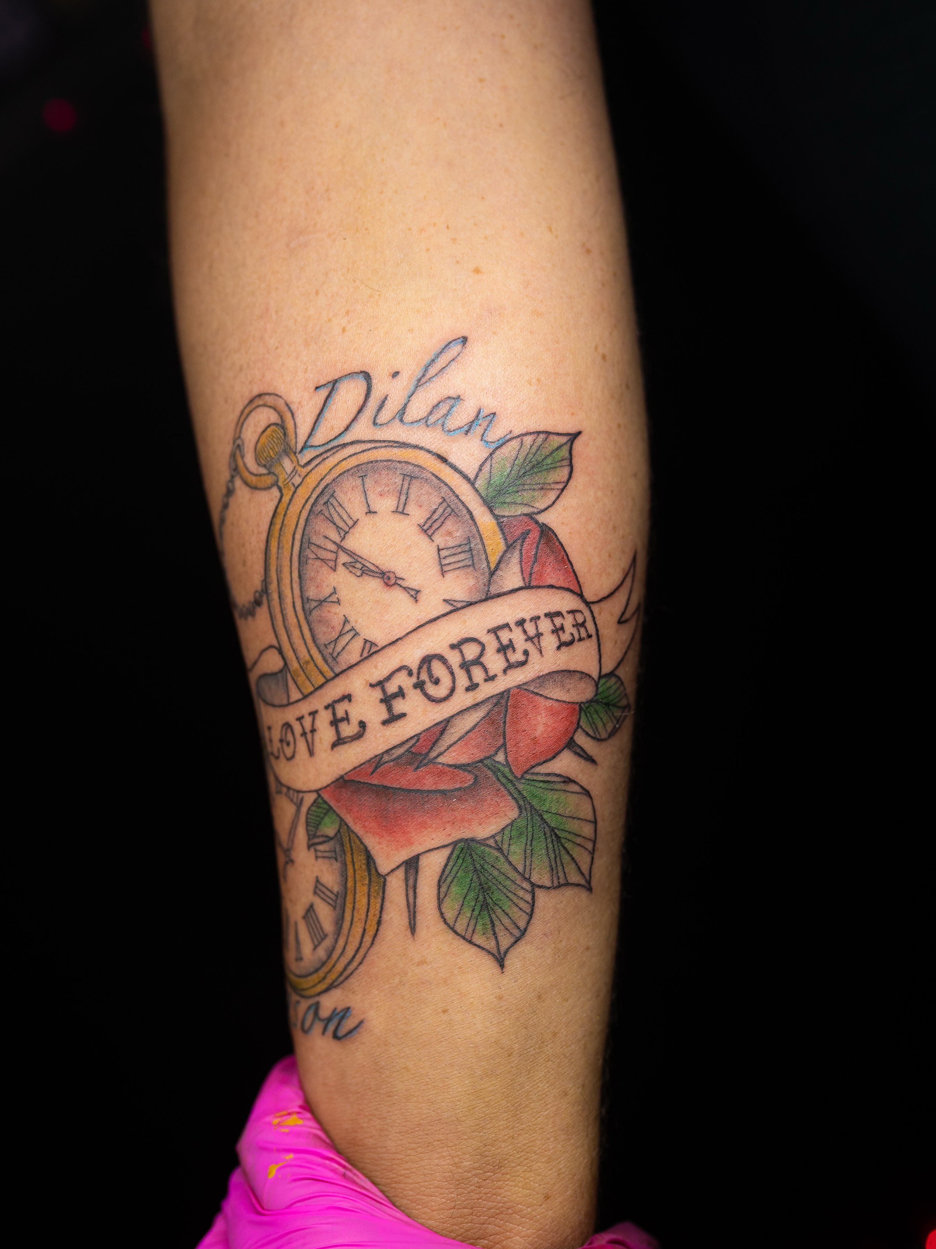 Clock and rose American traditional tattoo on the forearm by Kelsie