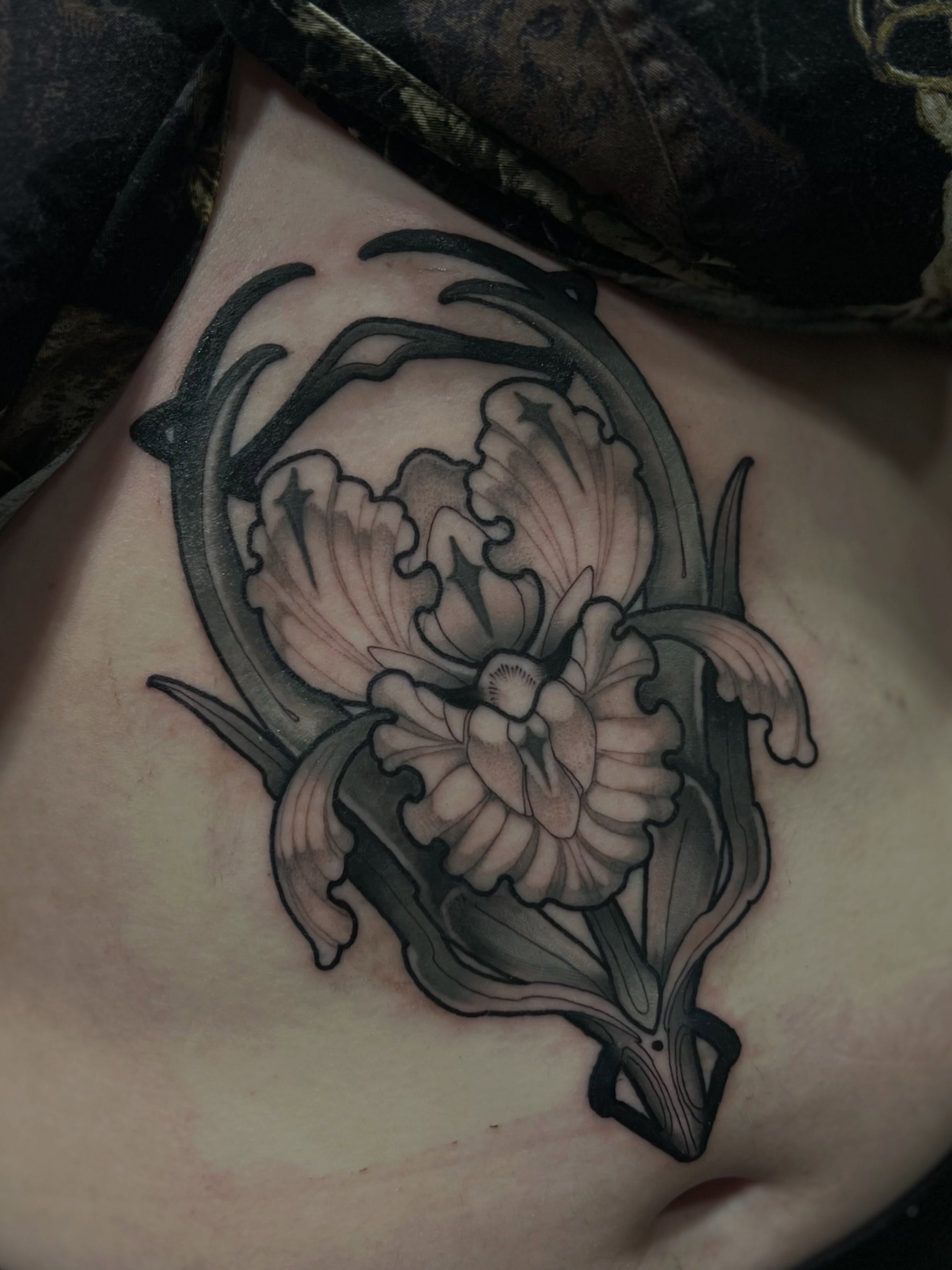 Orchid black and grey tattoo on the ribs by Jen Love