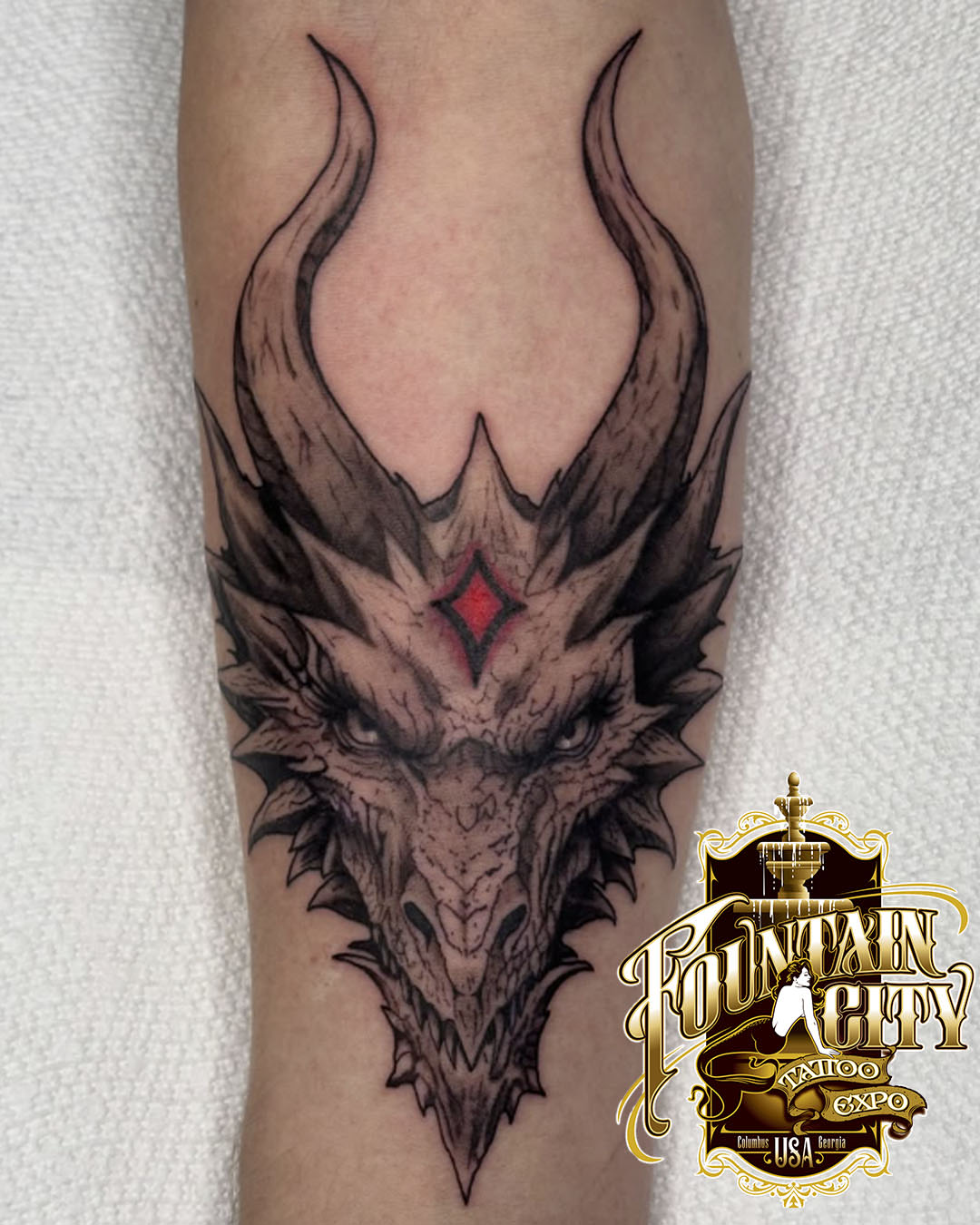 Dragon head dark realism tattoo on the forearm by kylie