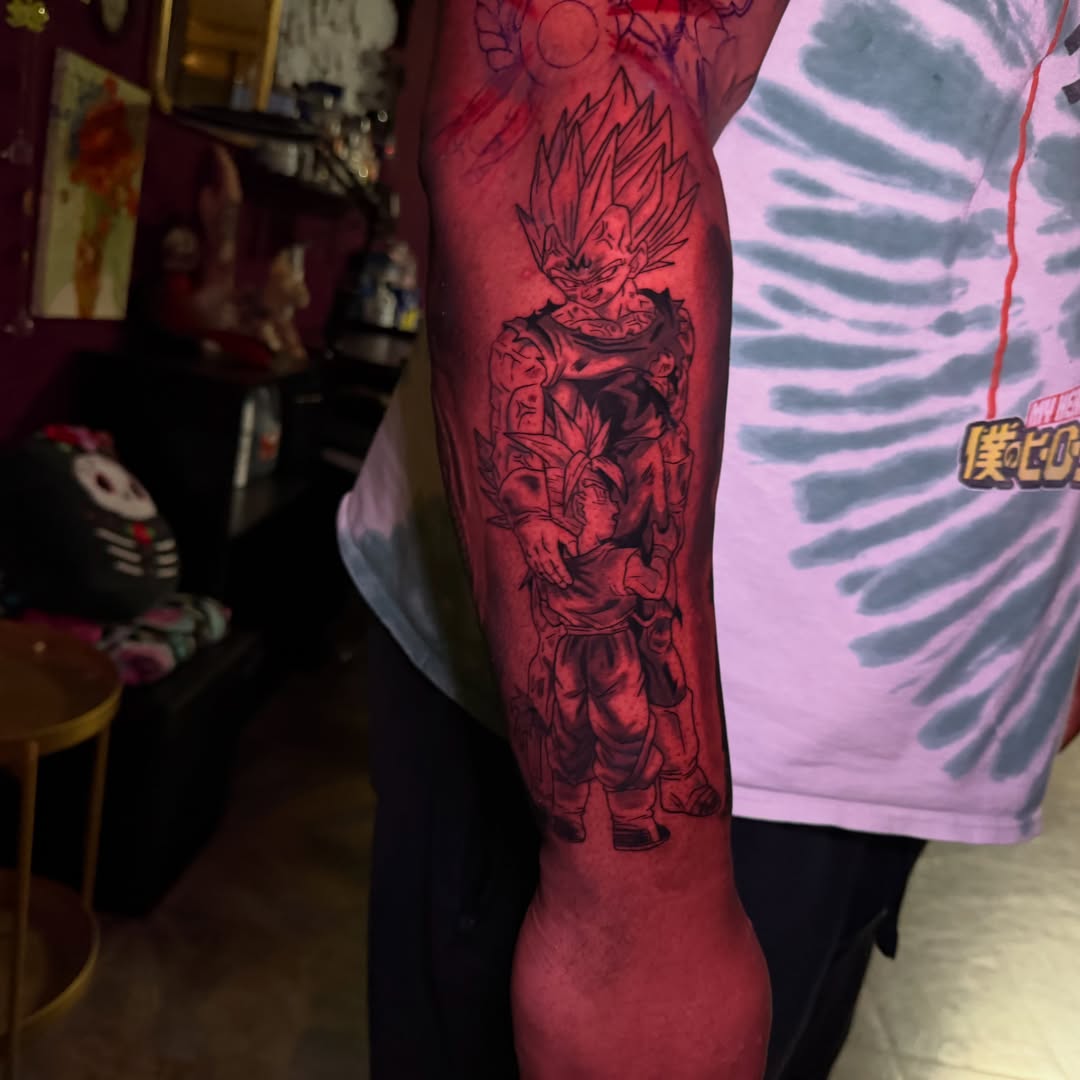 Vegeta and son goku anime tattoo on the forearm by Yohana Vargas