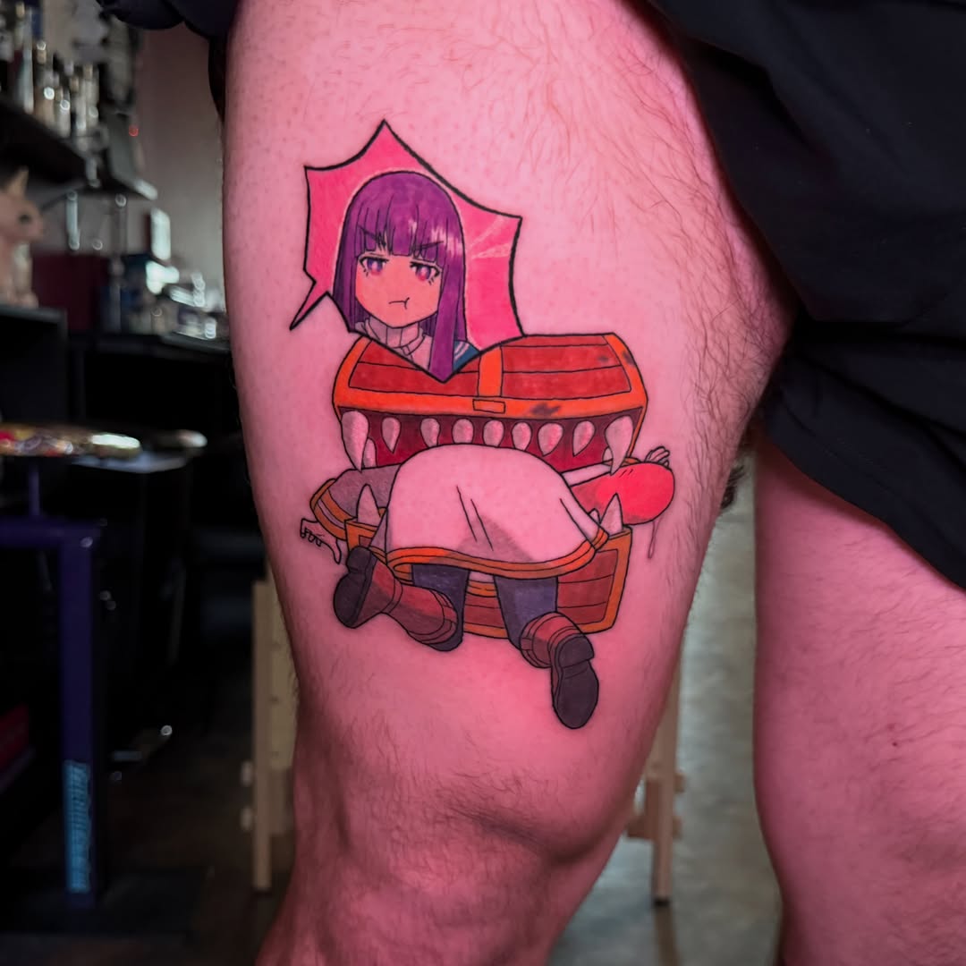 Anime character in coffin anime tattoo on the thigh by Yohana Vargas