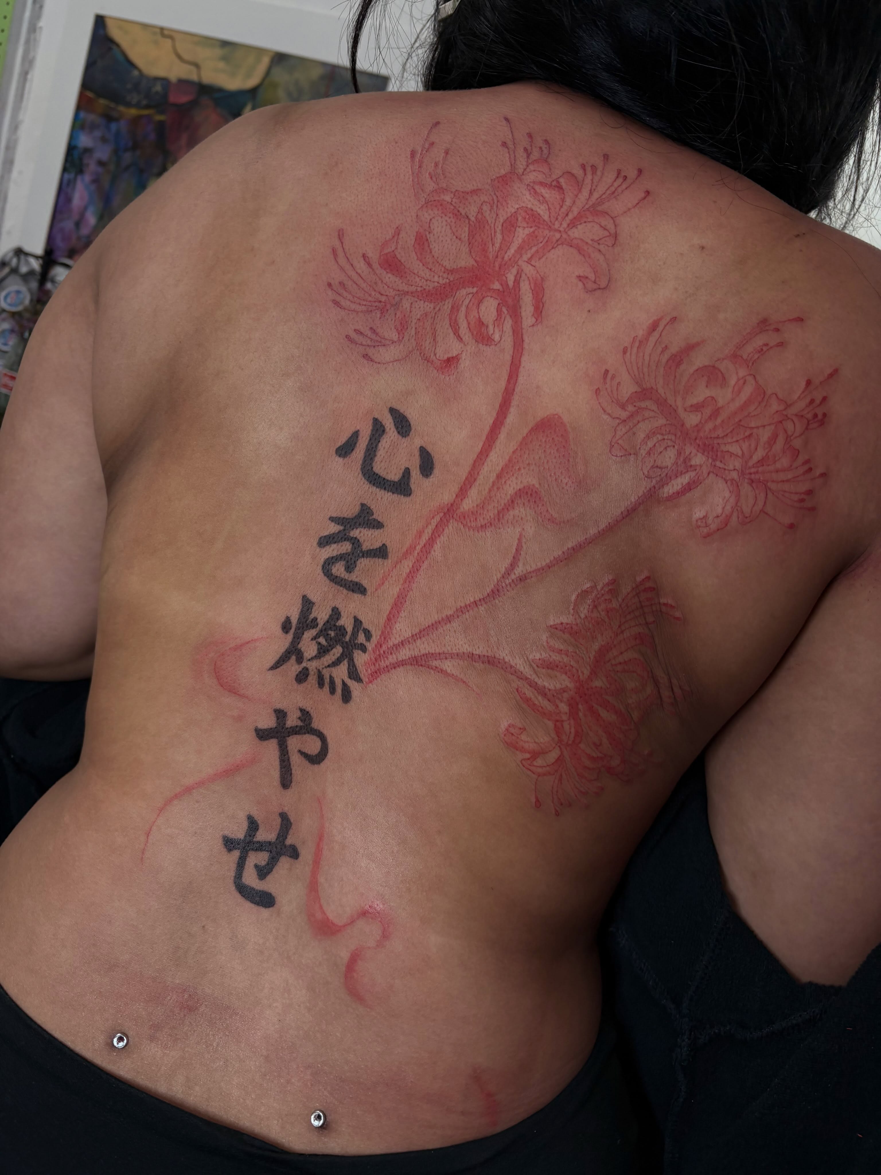 Chrysanthemums and kanji japanese irezumi tattoo on the back by Cincinnati Tattoo Artist