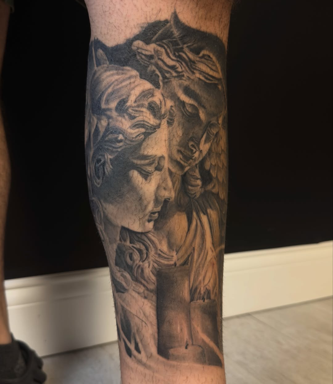Statue heads realism tattoo on the forearm by Eric RudeInk