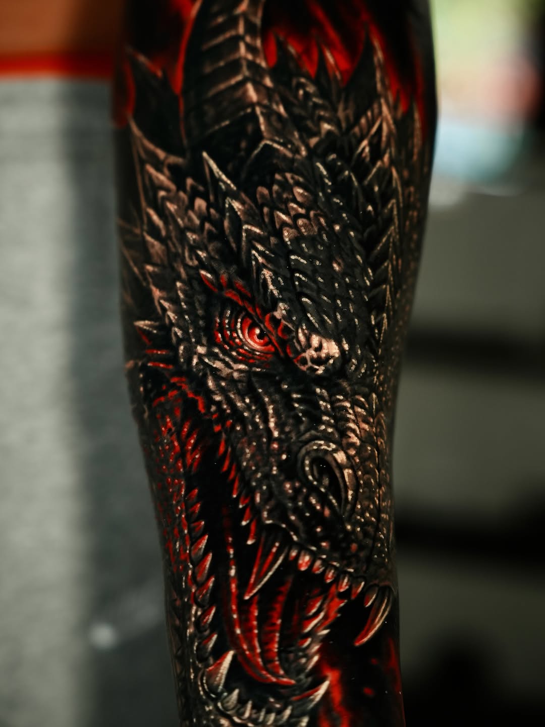 Dragon head realism tattoo on the forearm by Luis Lopez Tattoo