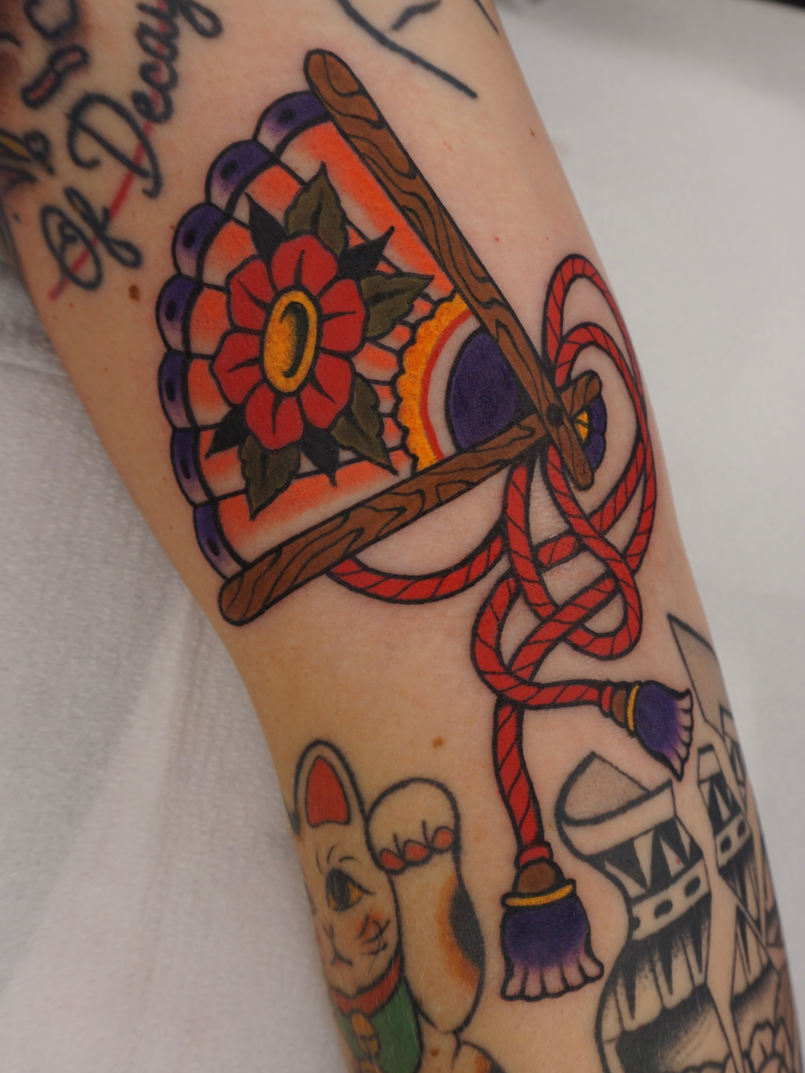 Hat and rope American traditional tattoo on the forearm by Sarah Christine Tattoo, Calgary, Alberta