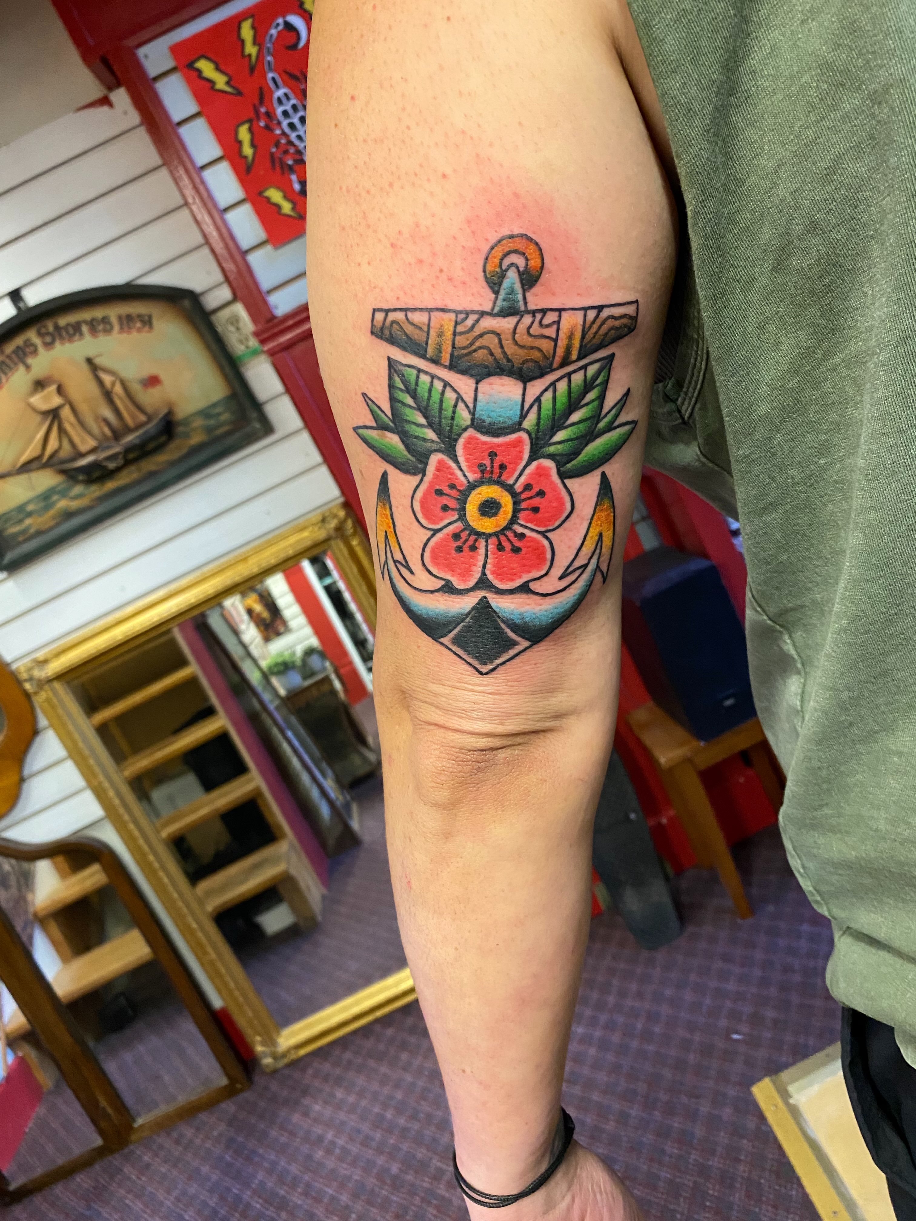 Anchor with flower American traditional tattoo on the forearm by Tommy O'Connell