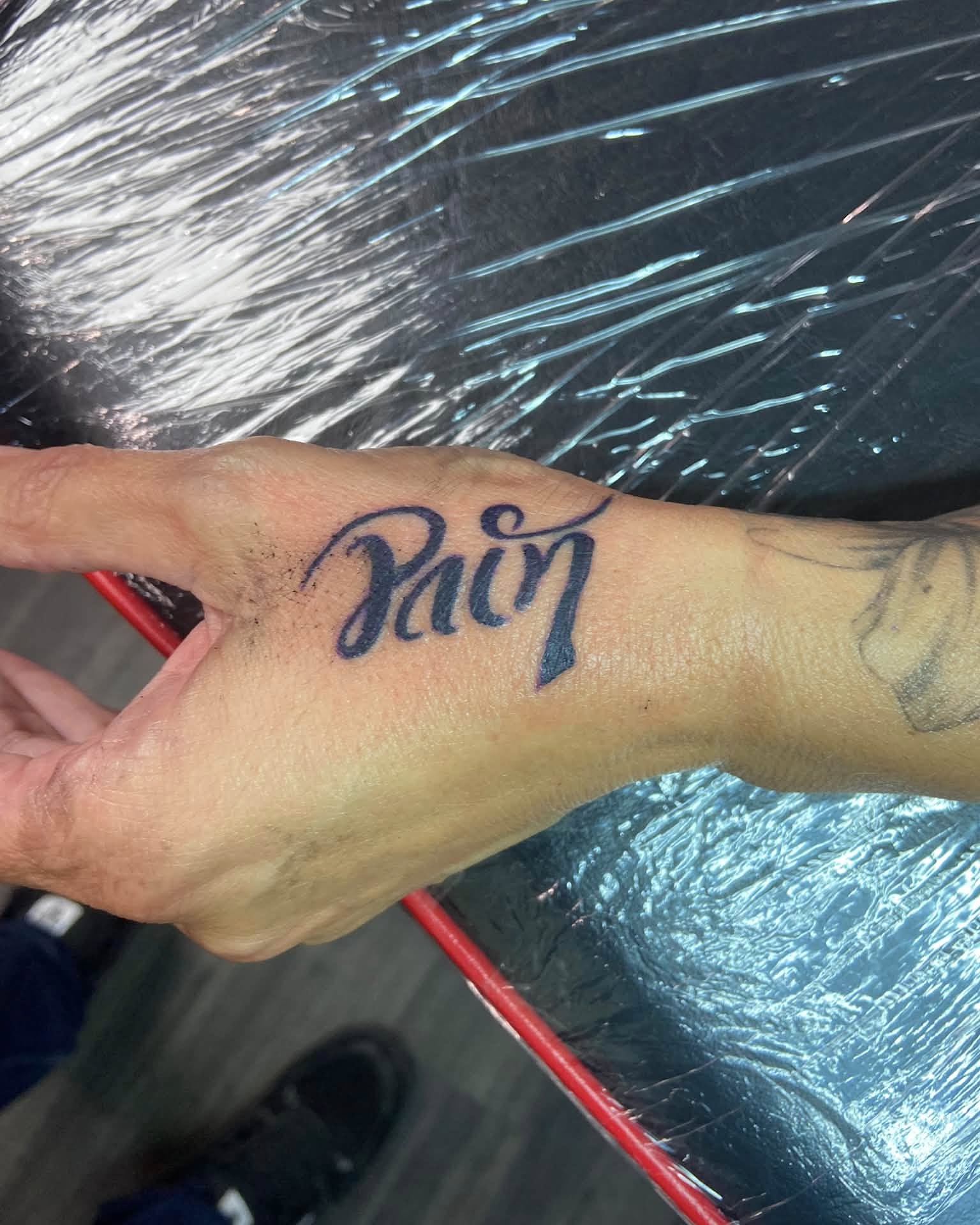 Script lettering lettering script tattoo on the hand by Mike Berry