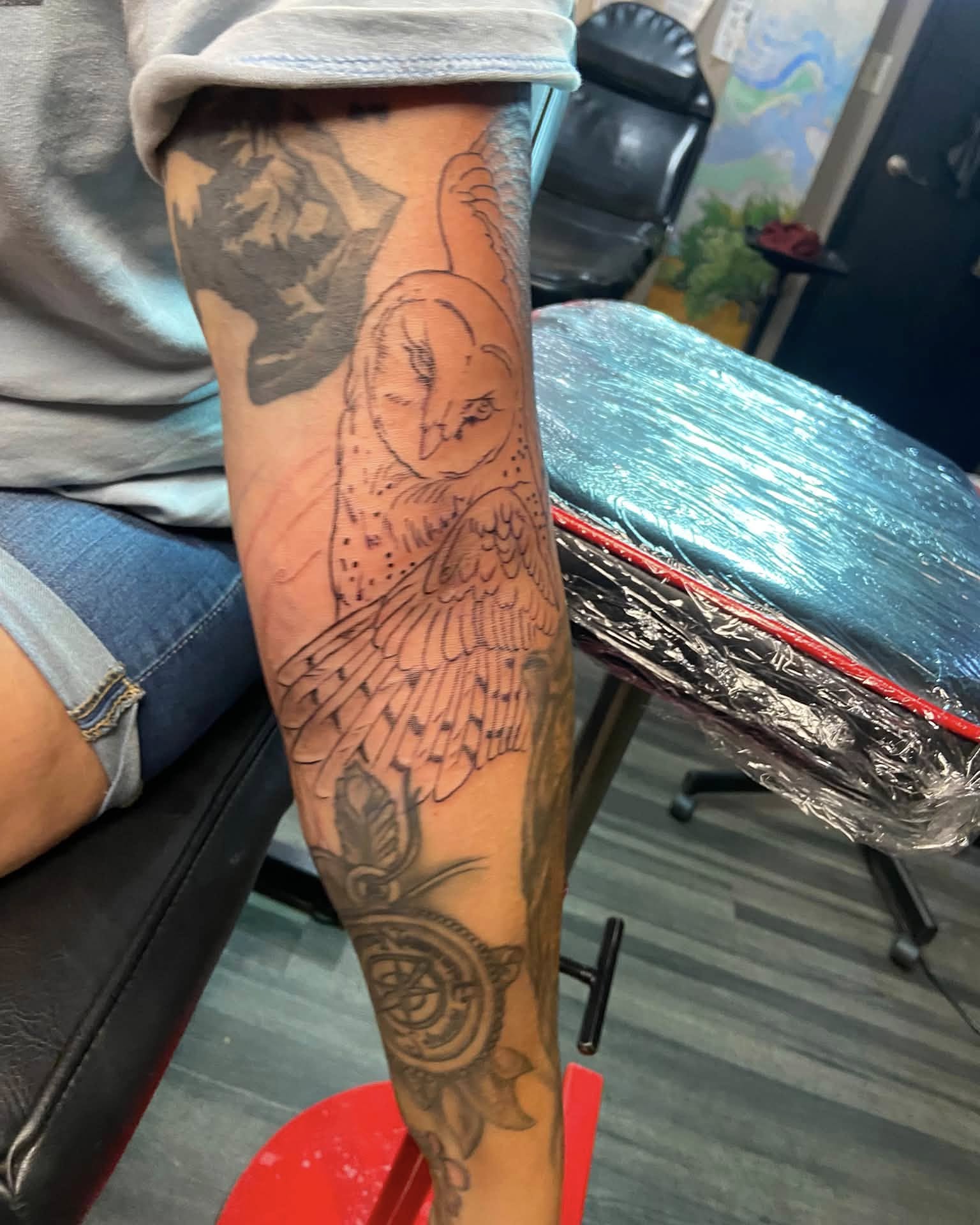 Owl American traditional tattoo on the forearm by Mike Berry