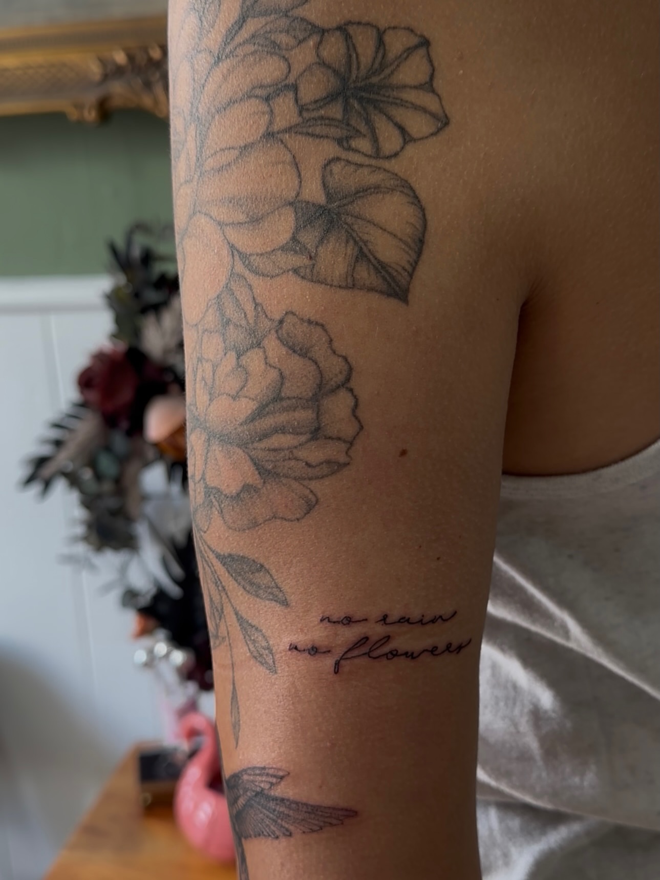 Flowers black and grey tattoo on the forearm by Allexis