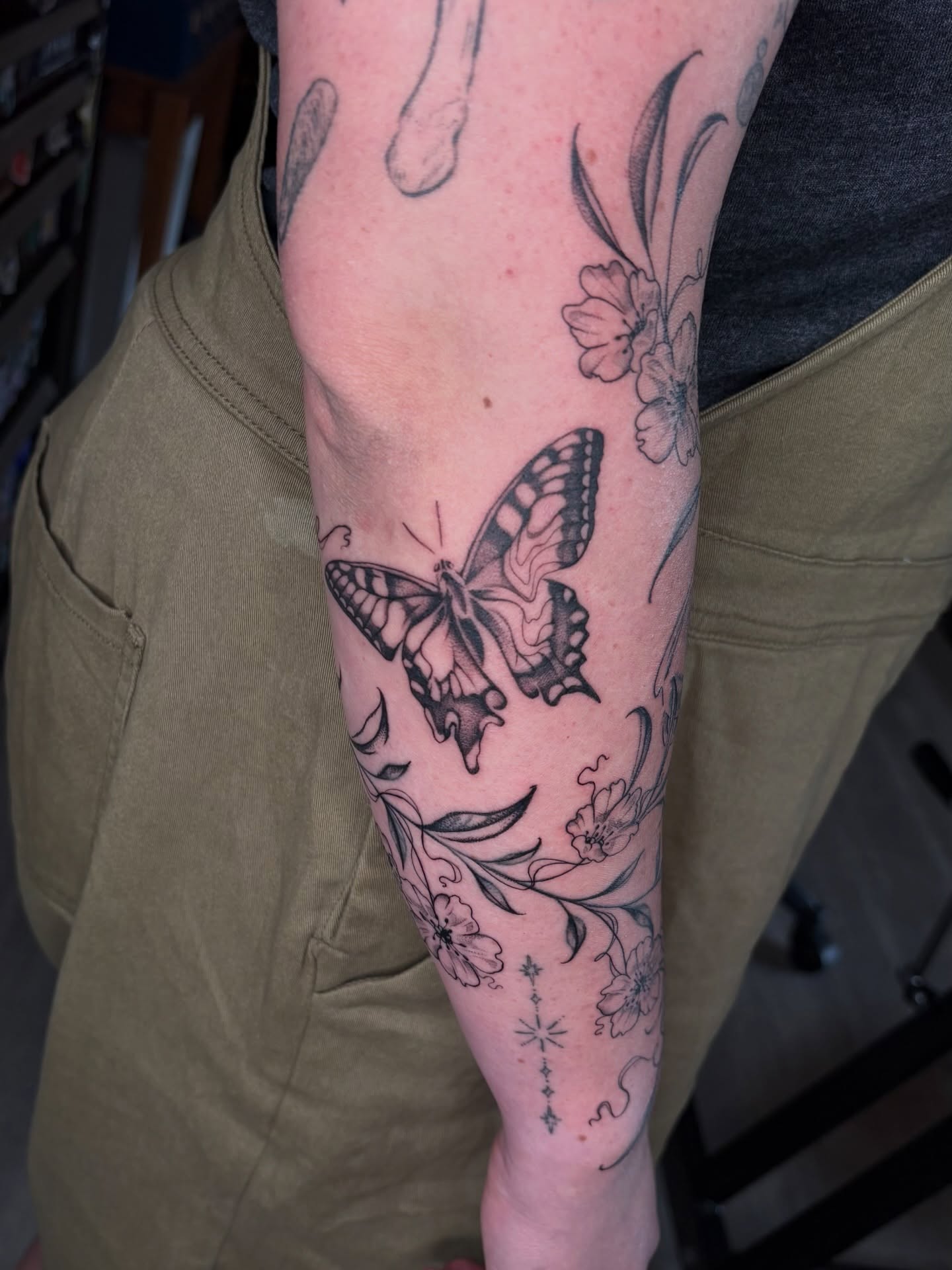 Butterfly and floral black and grey tattoo on the forearm by emery ♡ slc utah tattoo artist
