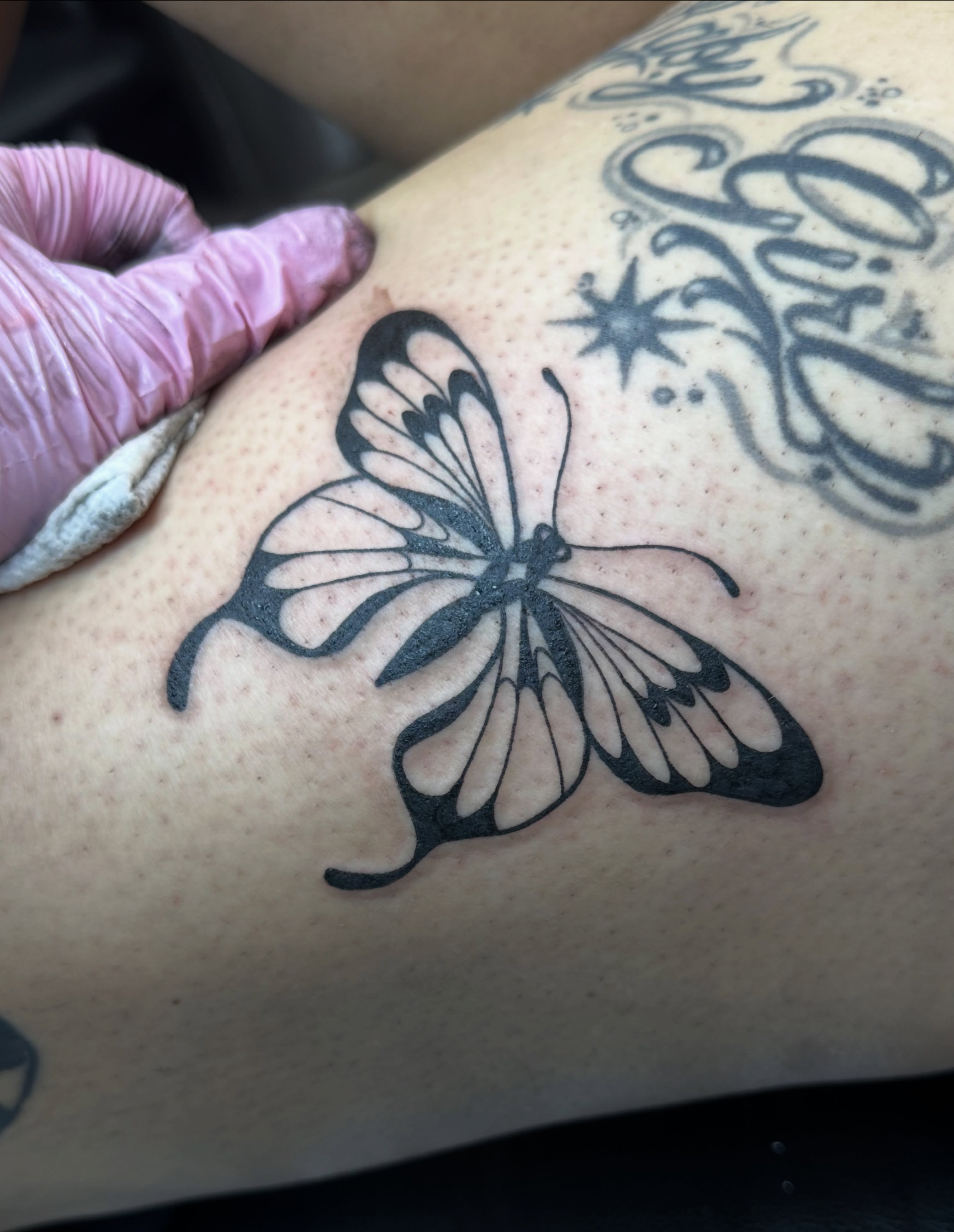 Butterfly black and grey tattoo on the thigh by Ash Nicole Painterly, San Diego, California