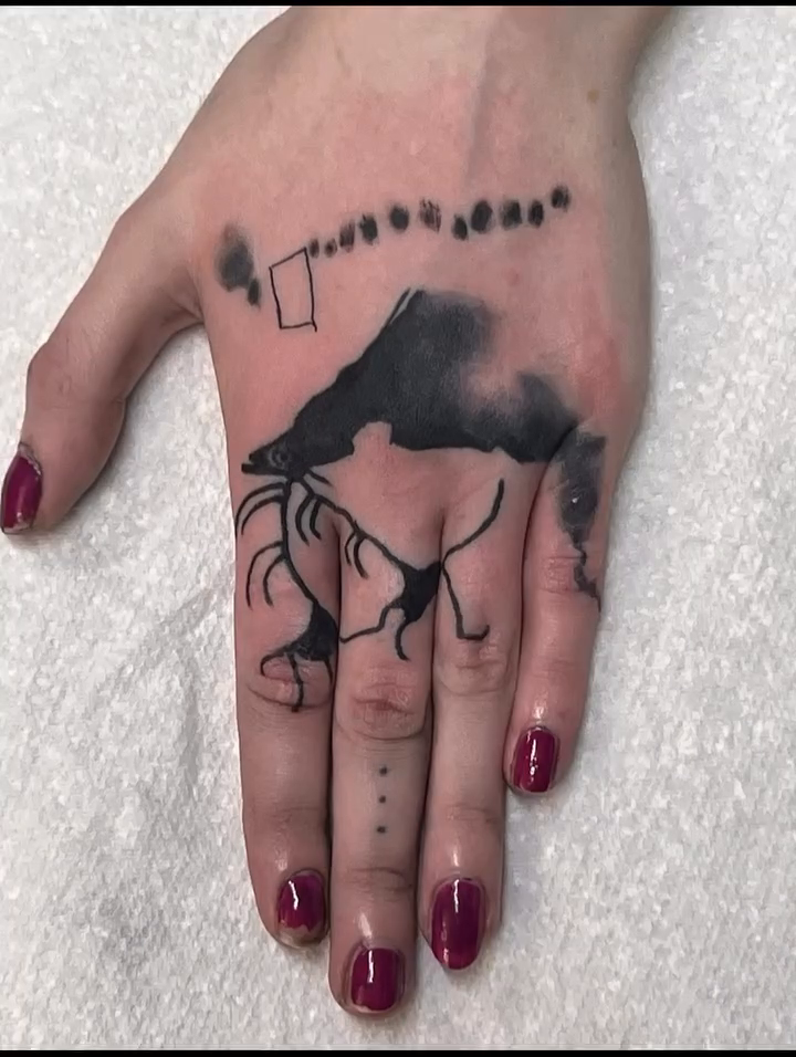 Mountain range with figures ignorant tattoo on the hand by julia seizure - tattooist