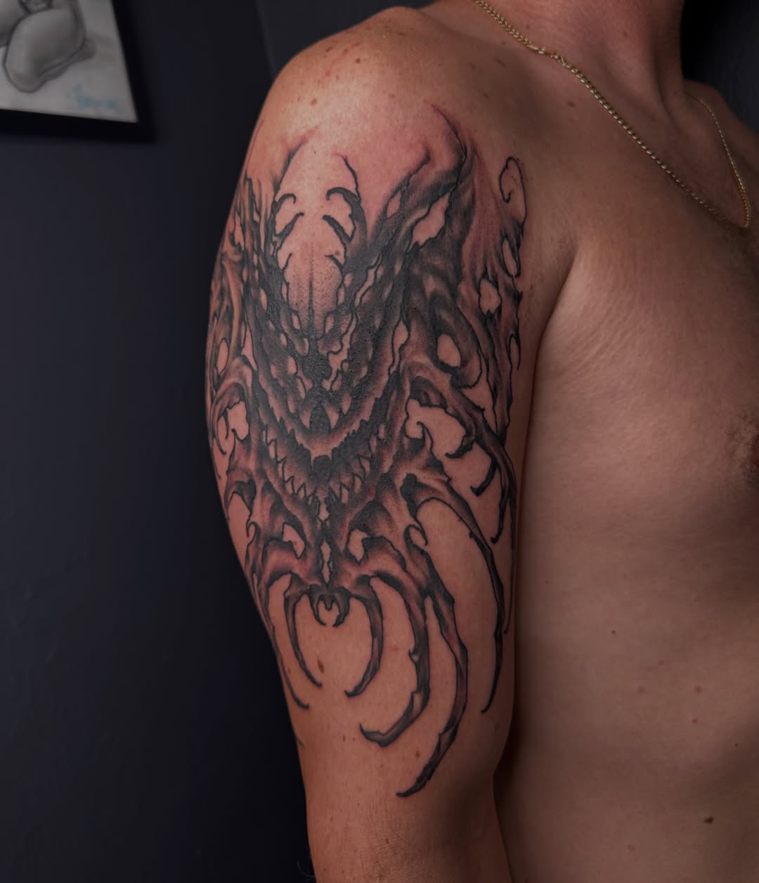 Demon dark realism tattoo on the shoulder by Dallas Davis