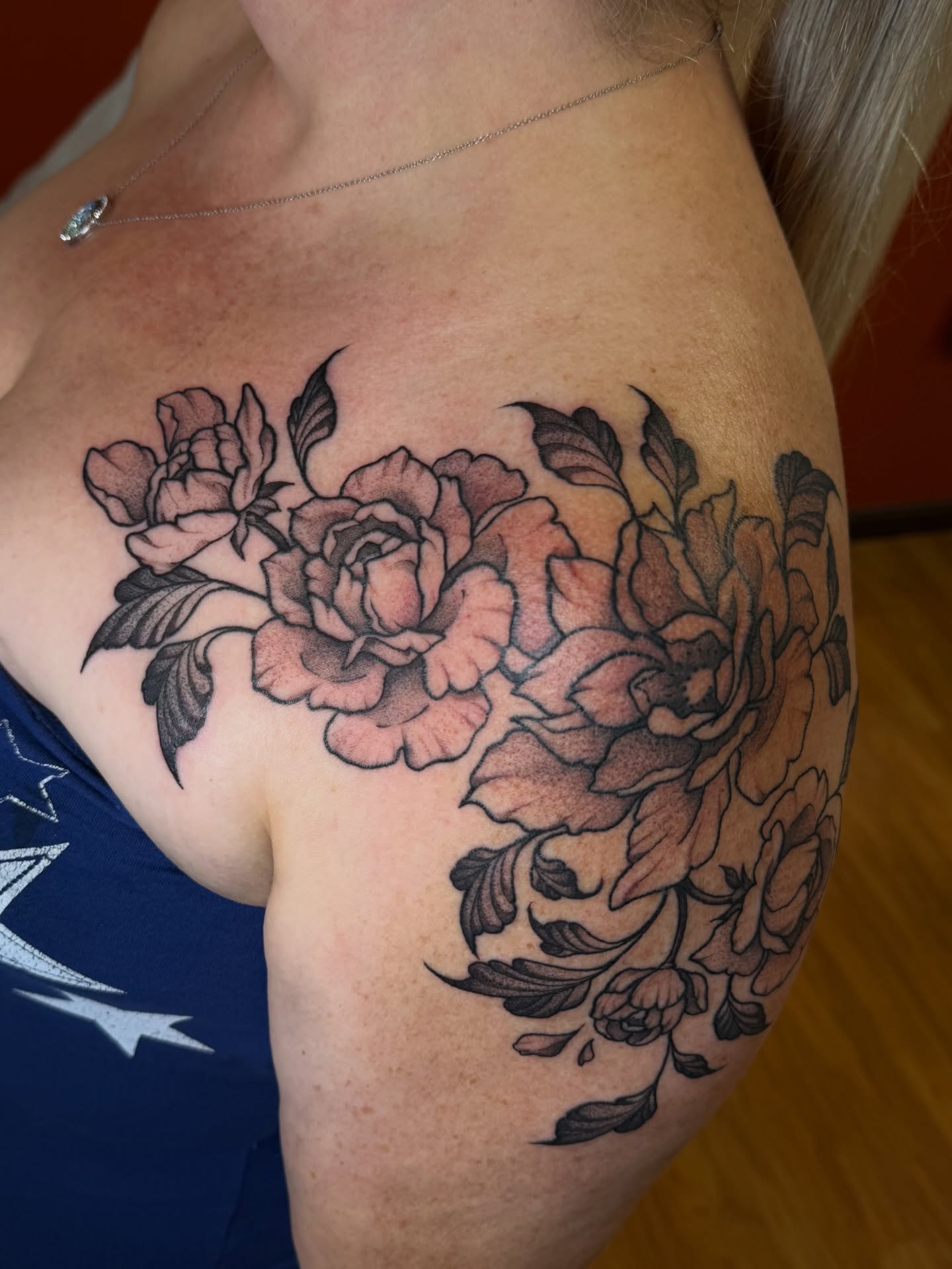 Peony bouquet black and grey tattoo on the shoulder by Gianna Calisi