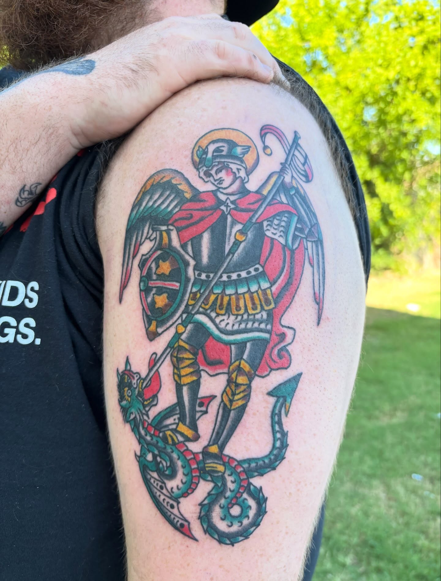 St. michael slaying dragon American traditional tattoo on the shoulder by Ethan Ellis, Dallas, Texas