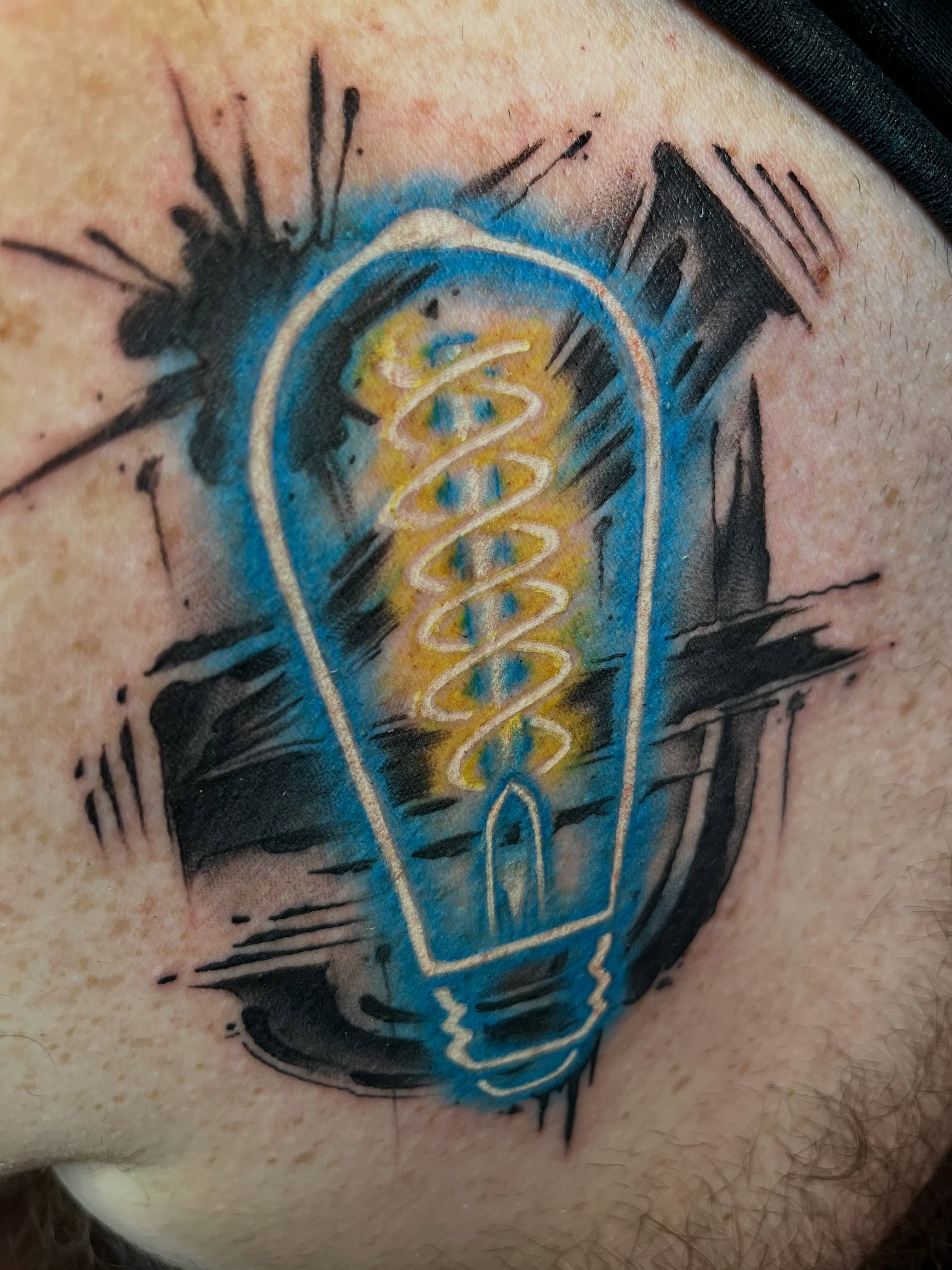 Light bulb new school tattoo on the forearm by Cuda