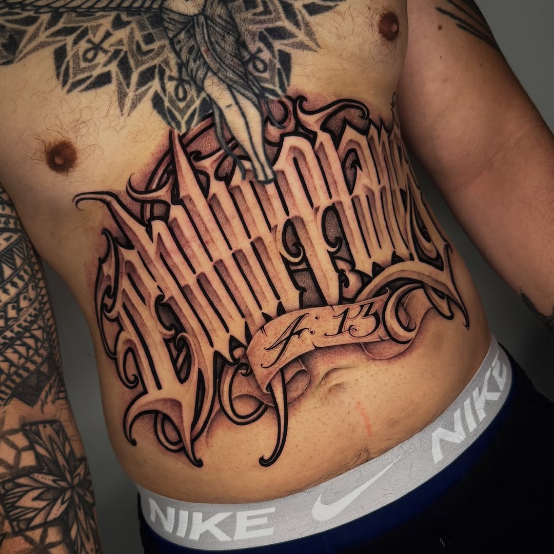 Tattoo by @dopeletterstattoo — lettering_script, chicano