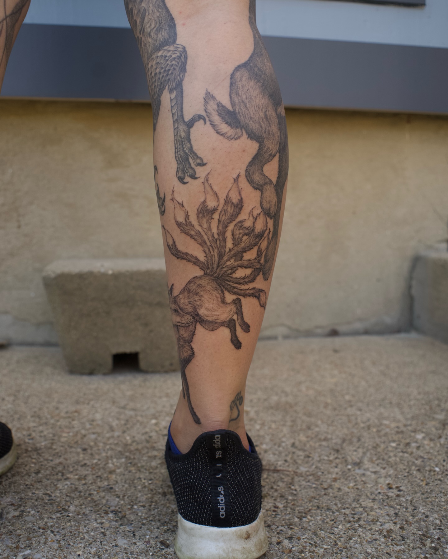 Unicorn and plant black and grey tattoo on the calf by Kevin Rotramel, Dayton, Ohio