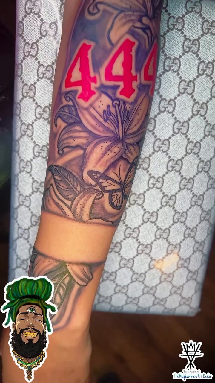 Arm tattoo with lilies and numbers fine line tattoo on the upper arm by The Neighborhood Art Dealer™️