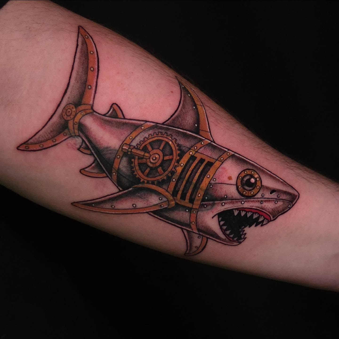 Mechanical shark geometric tattoo on the forearm by Maya Neideck