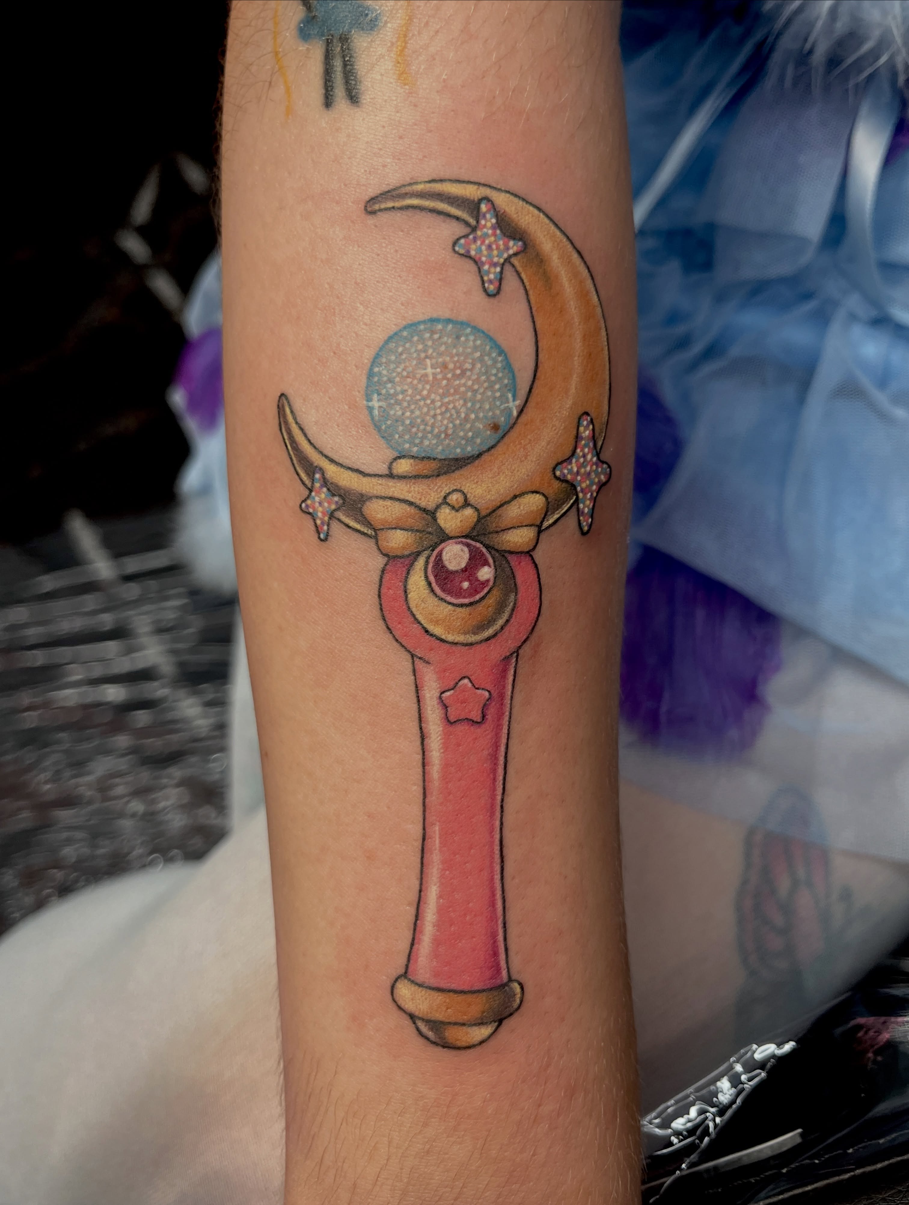 Magic wand new school tattoo on the forearm by Cheyanne Peck