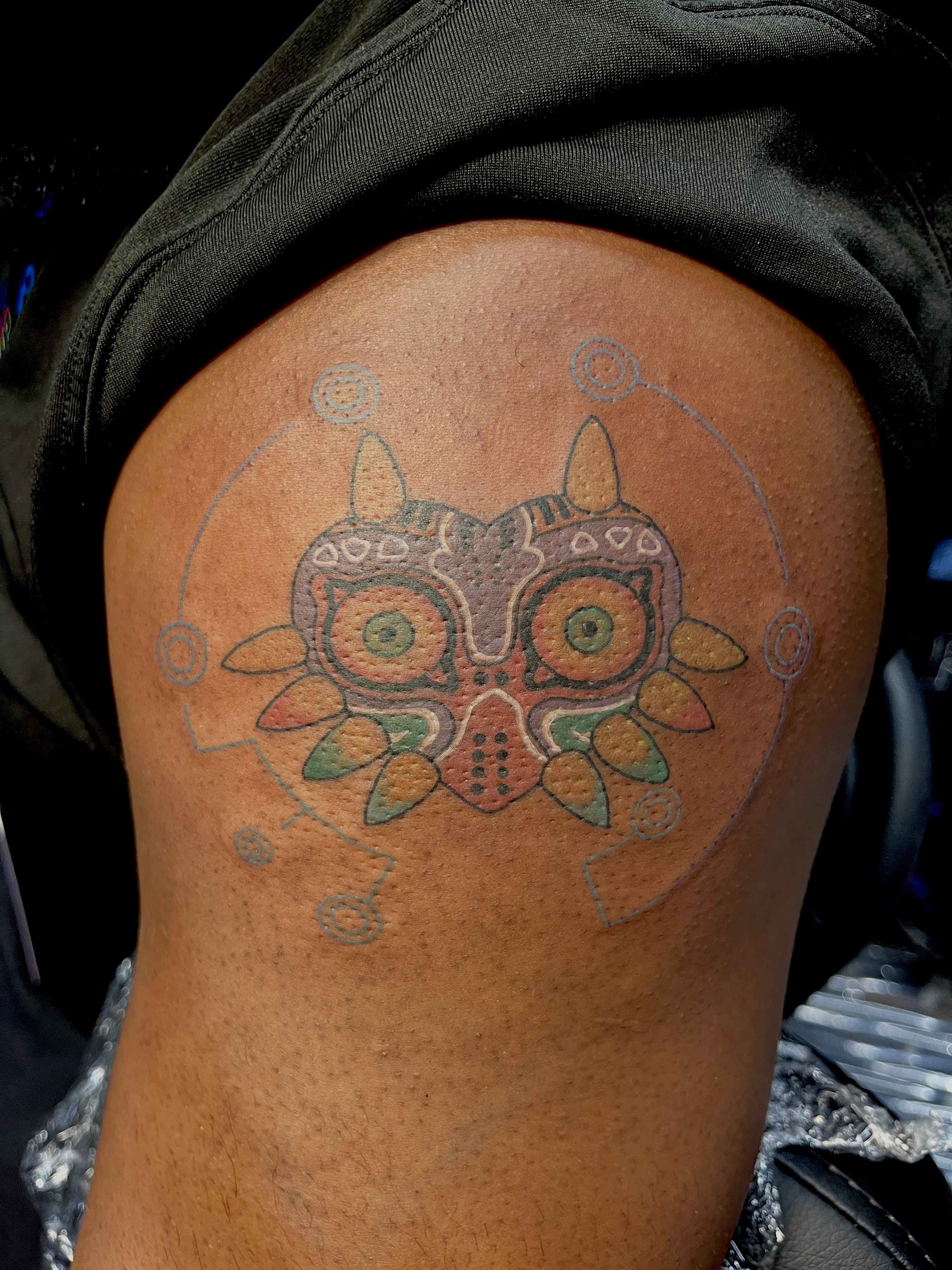 Majora's Mask dotwork tattoo on the shoulder by Cheyanne Peck