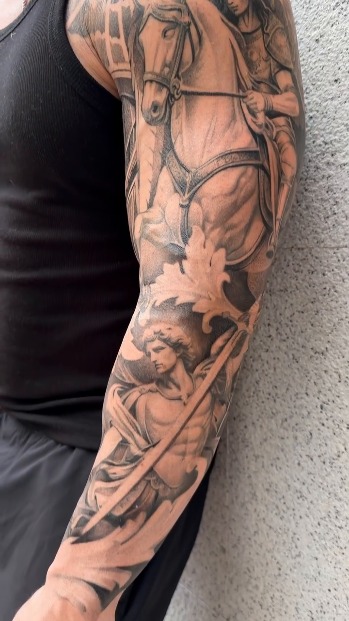 Chariot and figures realism tattoo by Viktor Govorukhin