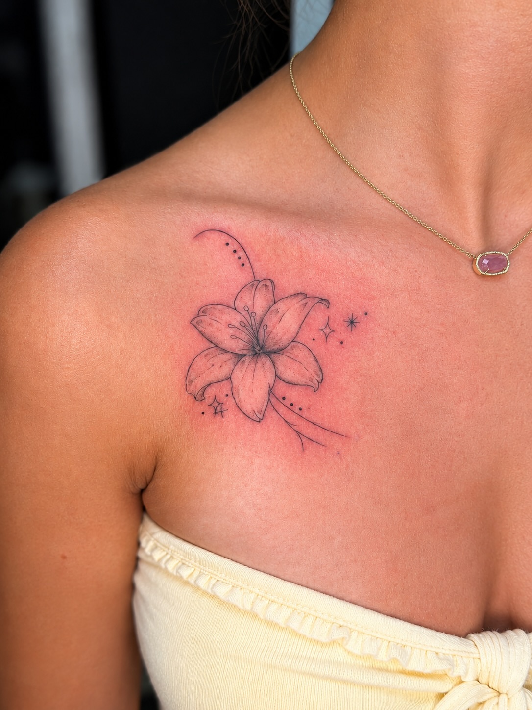Lily dotwork tattoo on the shoulder by JAmy Winters