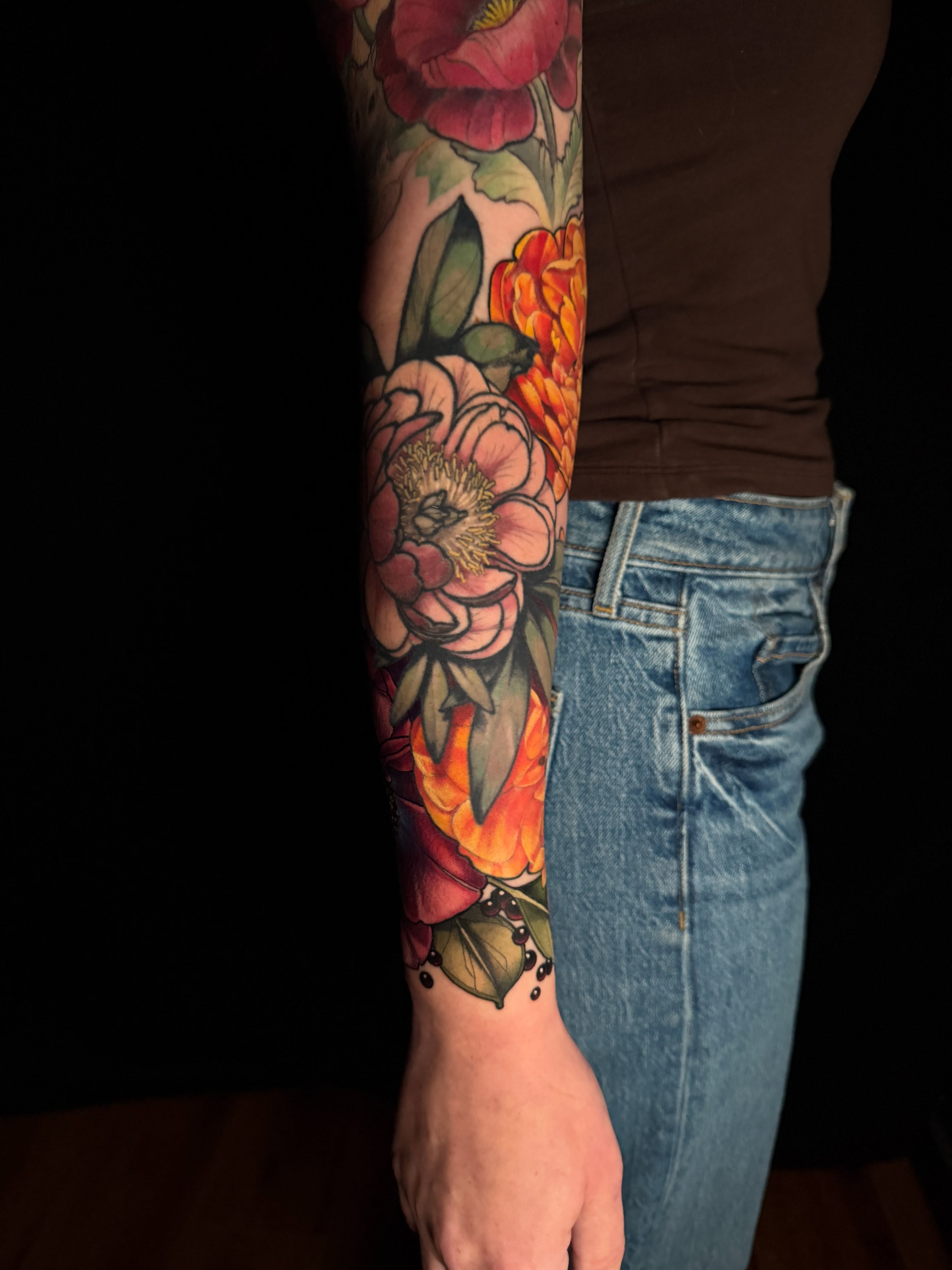 Floral bouquet new school tattoo on the forearm by Brad Snow