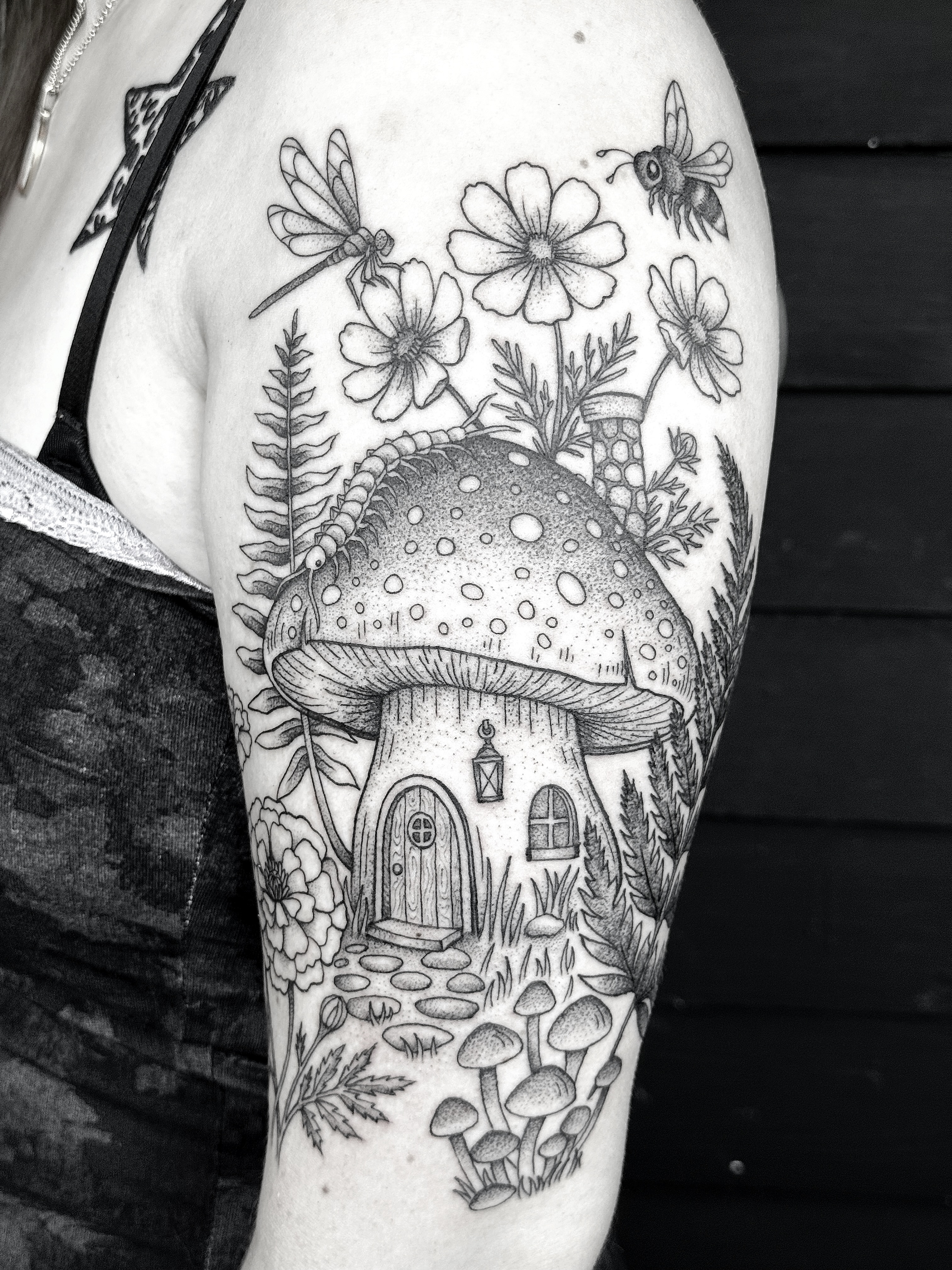 Mushroom house dotwork tattoo on the thigh by Breezy Tucker