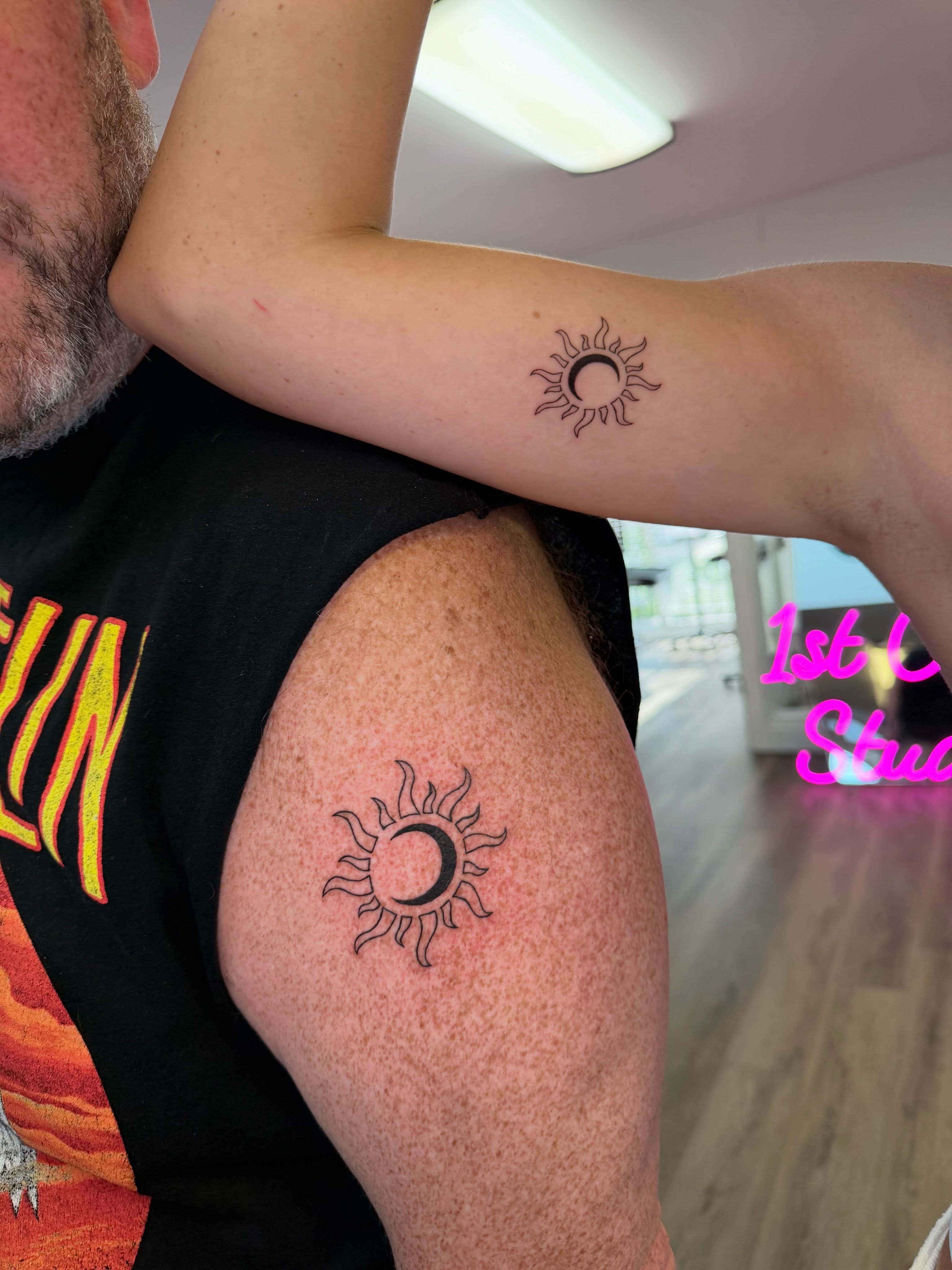 Sun and moon fine line tattoo on the shoulder by Fine Line Tattoo Artist