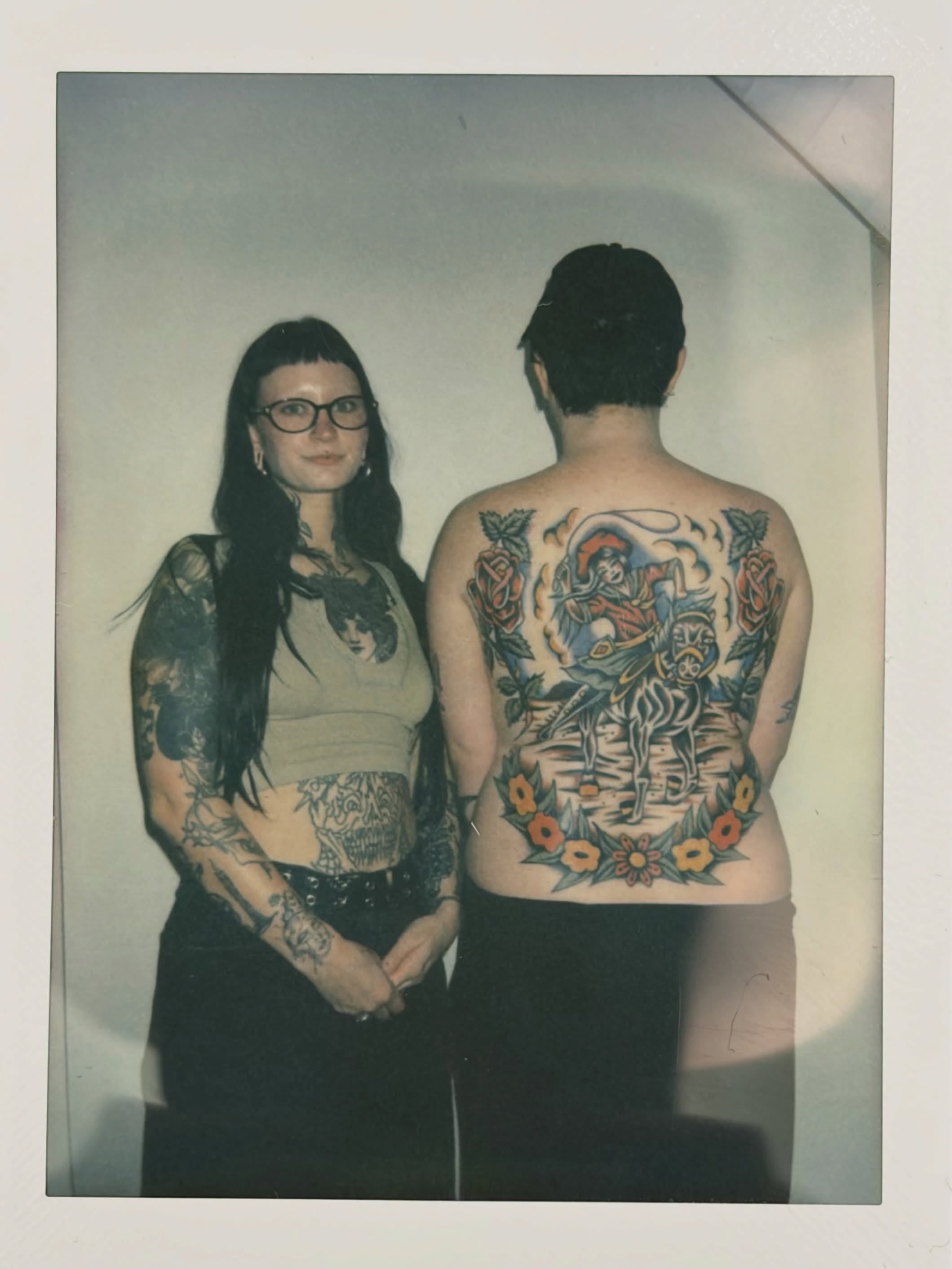 Horse and rider American traditional tattoo on the back by rachael