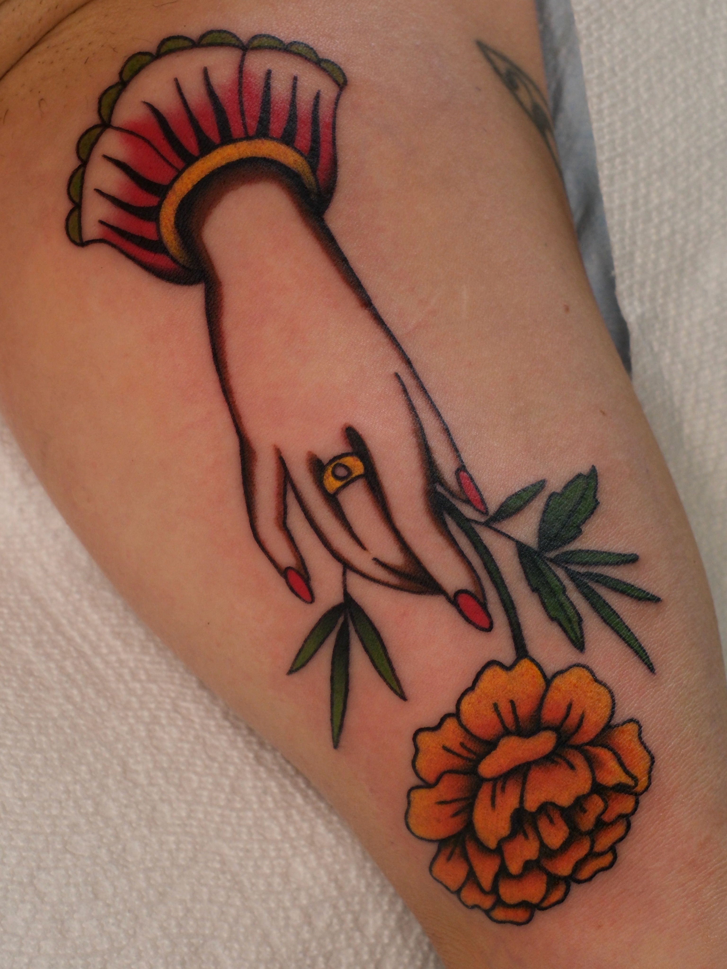 Hand with flower American traditional tattoo on the forearm by Mallory Murphy, Denton, Texas